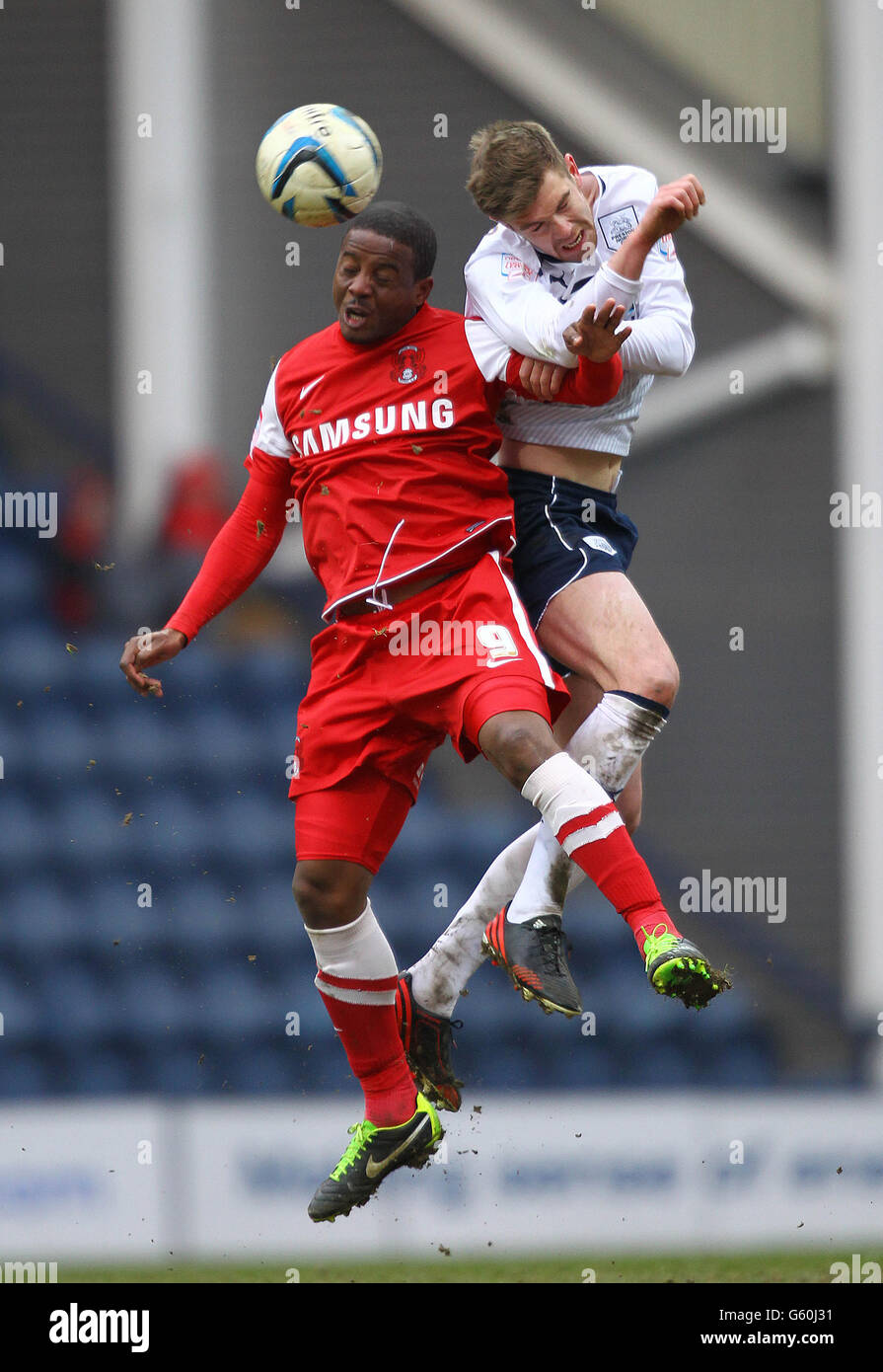 Preston North End's Paul Huntington (right) and Leyton Orient's Kevin Lisbie (left) battle for the ball in the air Stock Photo