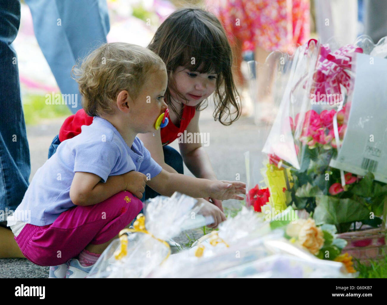 People lay flowers at St. Andrews Church, Soham, Cambs, for the murdered schoolgirls Holly Wells & Jessica Chapman. Stock Photo