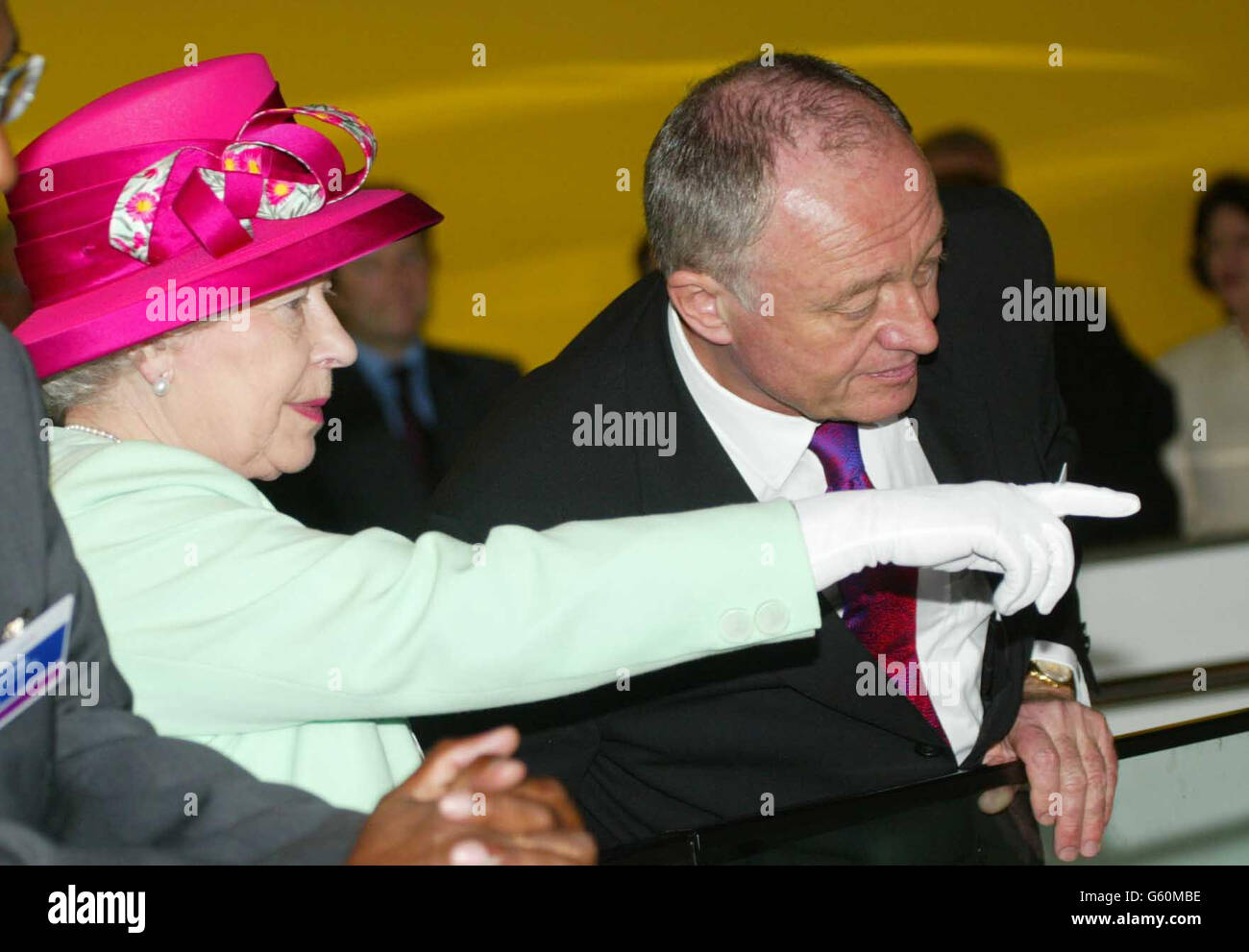 London's Mayor Ken Livingstone (right) with Britain's Queen Elizabeth II during a visit when she formally opened City Hall, which houses the London Assembly, on the south bank of the Thames, close to Tower Bridge. *The stunning building, designed by Foster and Partners, and constructed by Arup & Partners, has an assembly chamber, committee rooms and public facilities, together with offices for the Mayor, London Assembly Members and staff of the Greater London Authority. It provides 185,000 sq ft (gross) of space onten levels that can accommodate 440 staff and members. Stock Photo