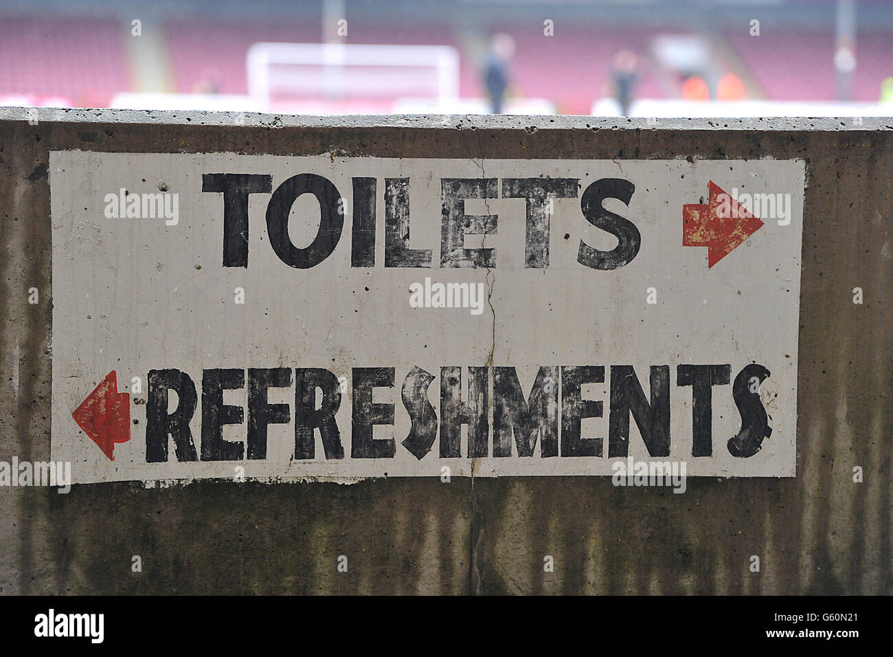General view of a sign showing directions towards 'Toilets' and ...