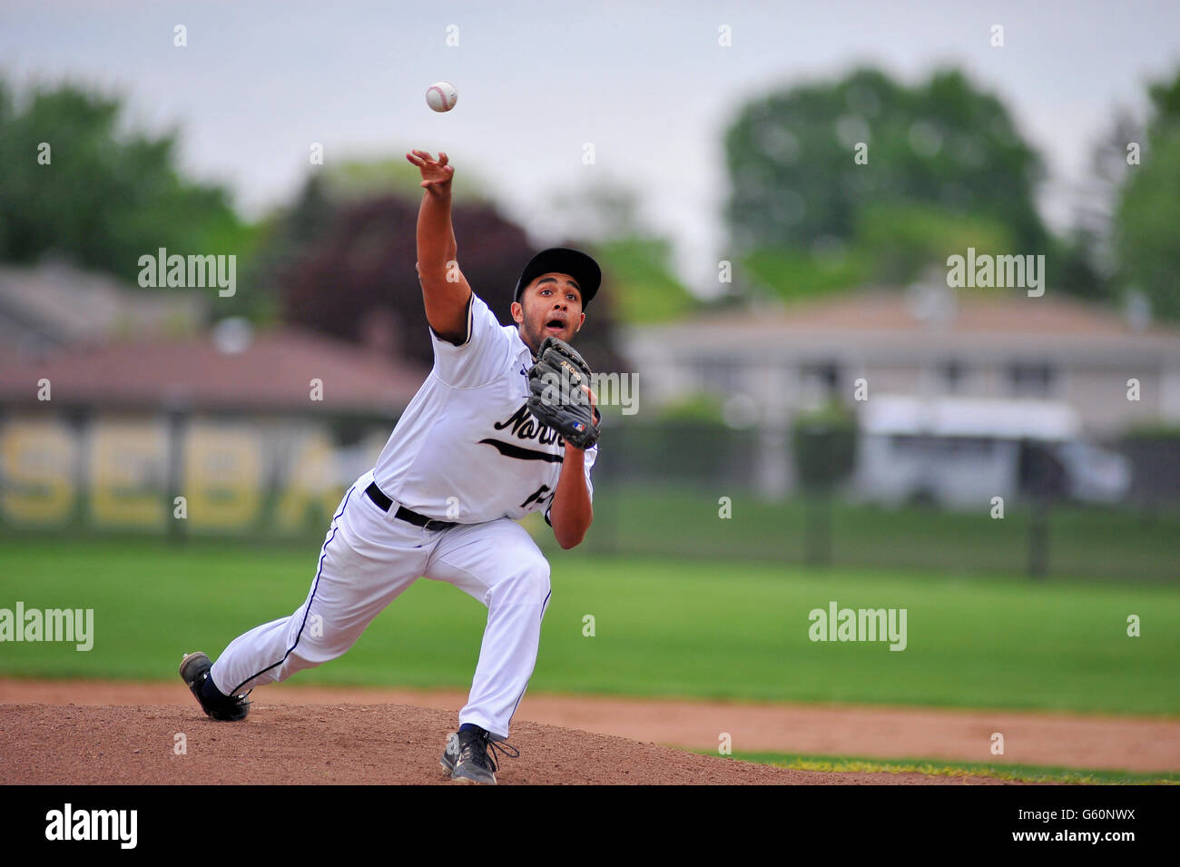 Righthanded pitcher releasing a pitch to a waiting hitter during a