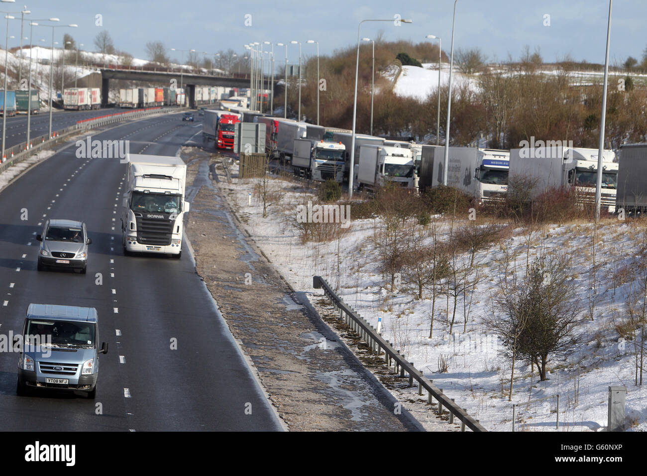 Lorries queue for the Channel Tunnel on the M20 near Folkestone in Kent as Operation Stack is