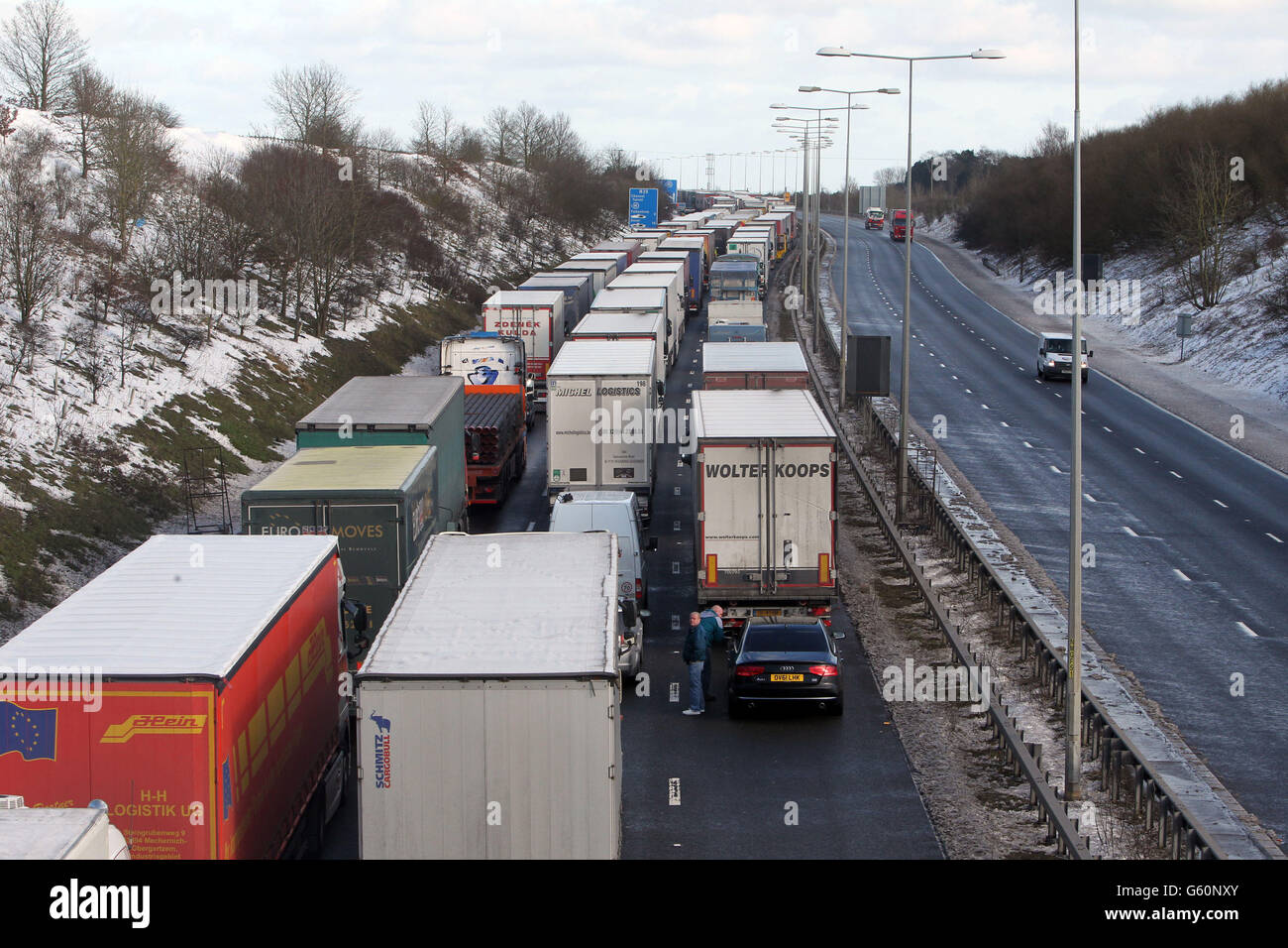 Lorries queue for the Channel Tunnel on the M20 near Folkestone in Kent as Operation Stack is