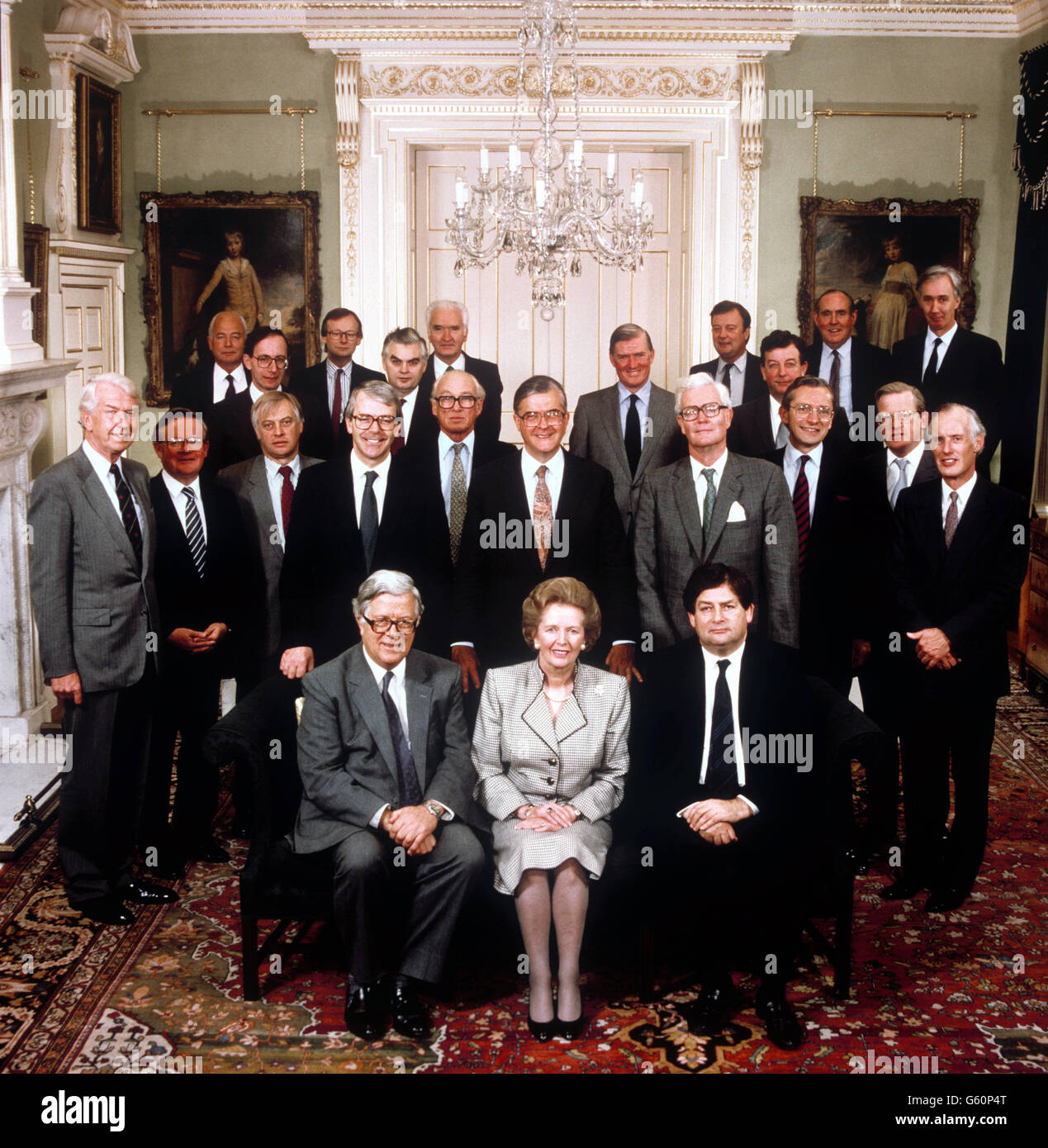 The cabinet photographed at Number 10 Downing Street. From left to right : front row: Nigel Lawson, Margaret Thatcher, Sir Geoffrey Howe. Middle row: right to left: Peter Walker, John MacGregor, Chris Patten, John Major, Nicholas Ridley, Kenneth Baker, Douglas Herd, Norman Fowler, Tom King, Antony Newton. Back row: right to left : David Waddington, Malcolm Rifkind, John Gummer, Norman Lamont, Lord Macay of Clashfern, Cecil Parkinson, Kenneth Clarke, John Wakeham, Peter Byooke, Lord Belstead. Stock Photo