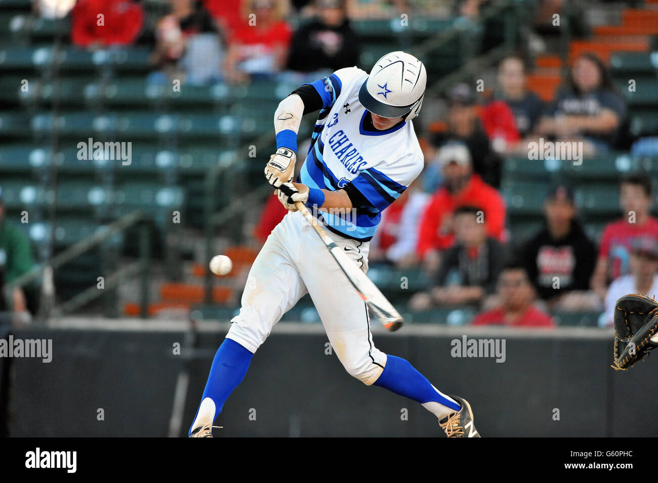 Batter delivering a game winning hit for with a drive past the first