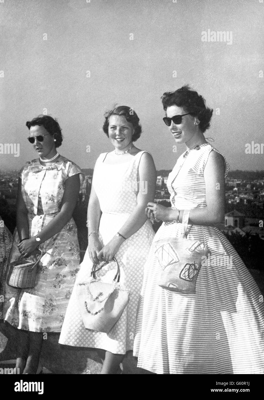 18-year-old Princess Beatrix of the Netherlands (centre) during a sightseeing tour of Rome, where she is on holiday. The princess is the eldest of four daughters of Queen Juliana and Prince Bernhard of the Netherlands. Stock Photo