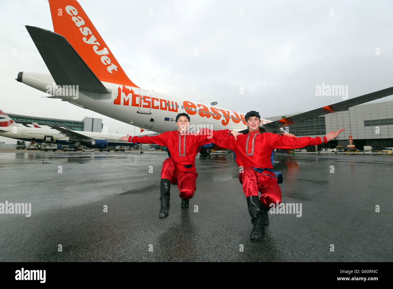 Russian Cossack Stanislav Lukasov (L) and Vladislav Kuznetsov perform for the media at London Gatwick Airport to launch the new easyJet route to Moscow. Stock Photo