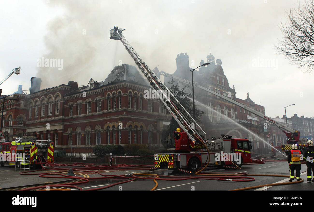 Firefighters attend the blaze at at the Newington Library on Walworth Road, Southwark, London. Stock Photo