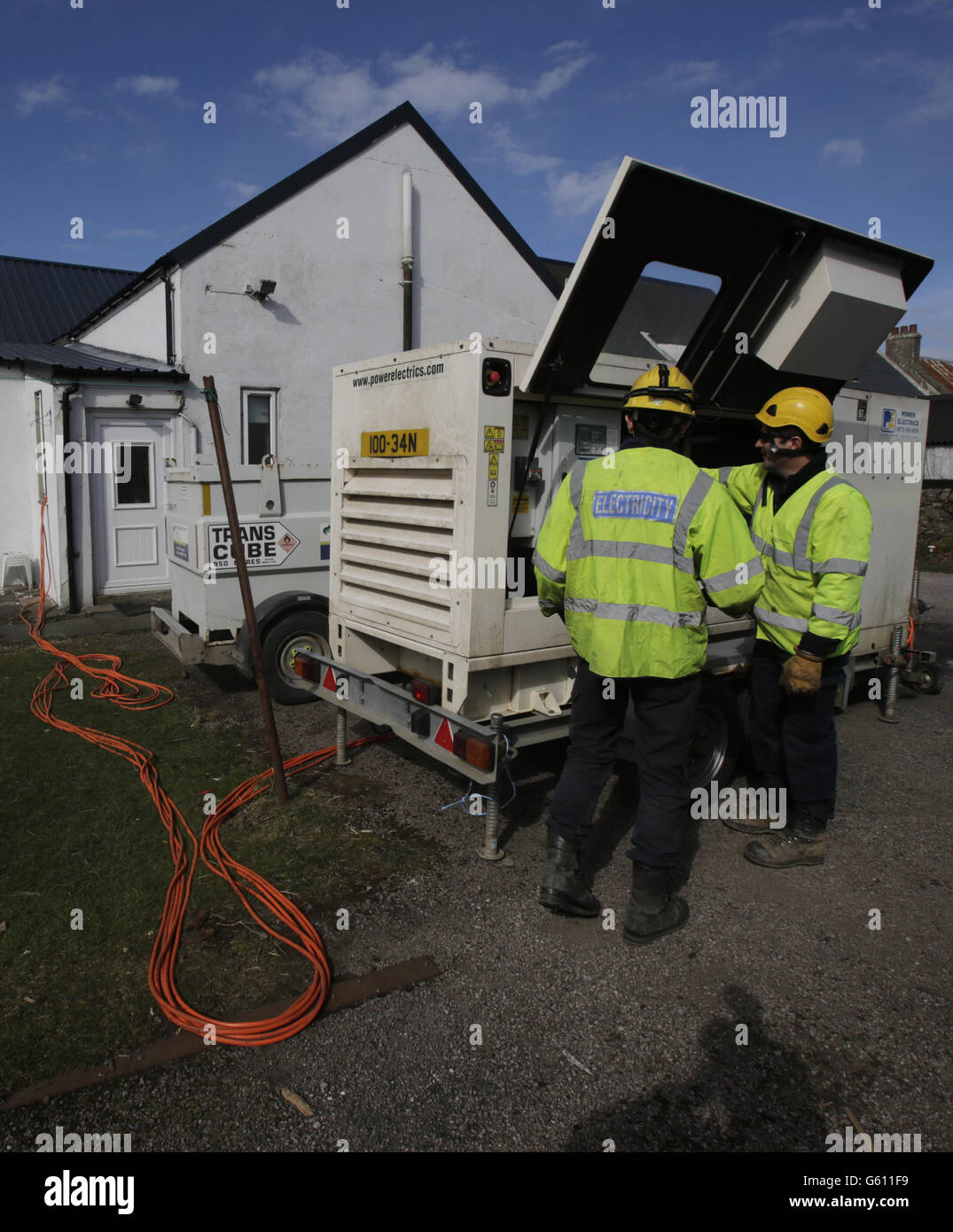 A temporary generator supplies power to a property in Southend, Scotland, that lost power during recent severe weather. Stock Photo
