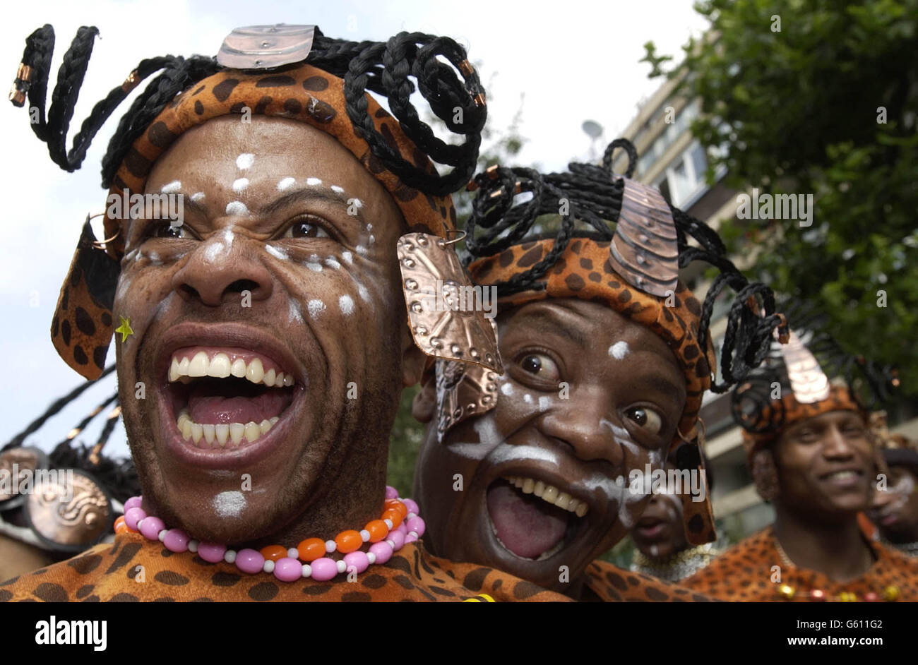 Members of the Umoja procession take part at the Notting Hill carnival, London. A police spokeswoman said 10,000 officers would be on duty over the two days, with 350 specially trained stewards, in an effort to prevent any trouble. * marring the largest street party in Europe. Stock Photo