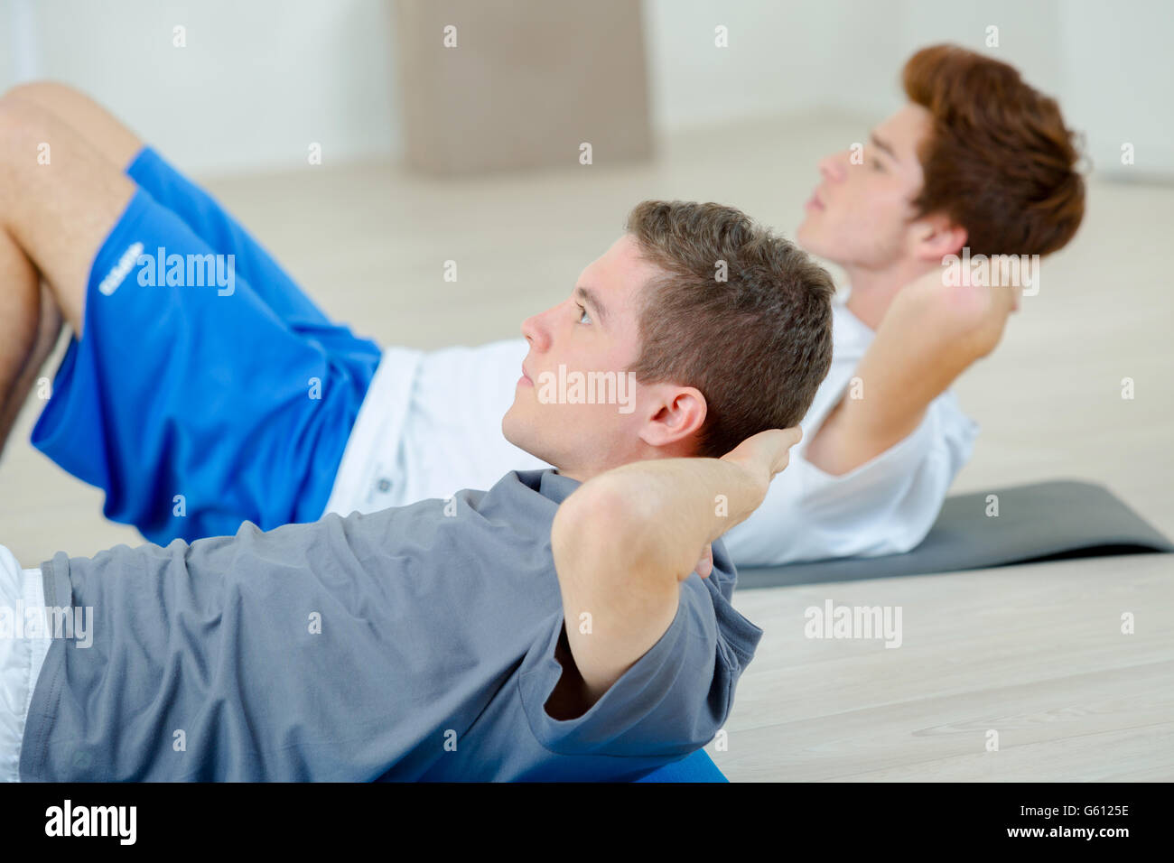 Doing sit ups Stock Photo