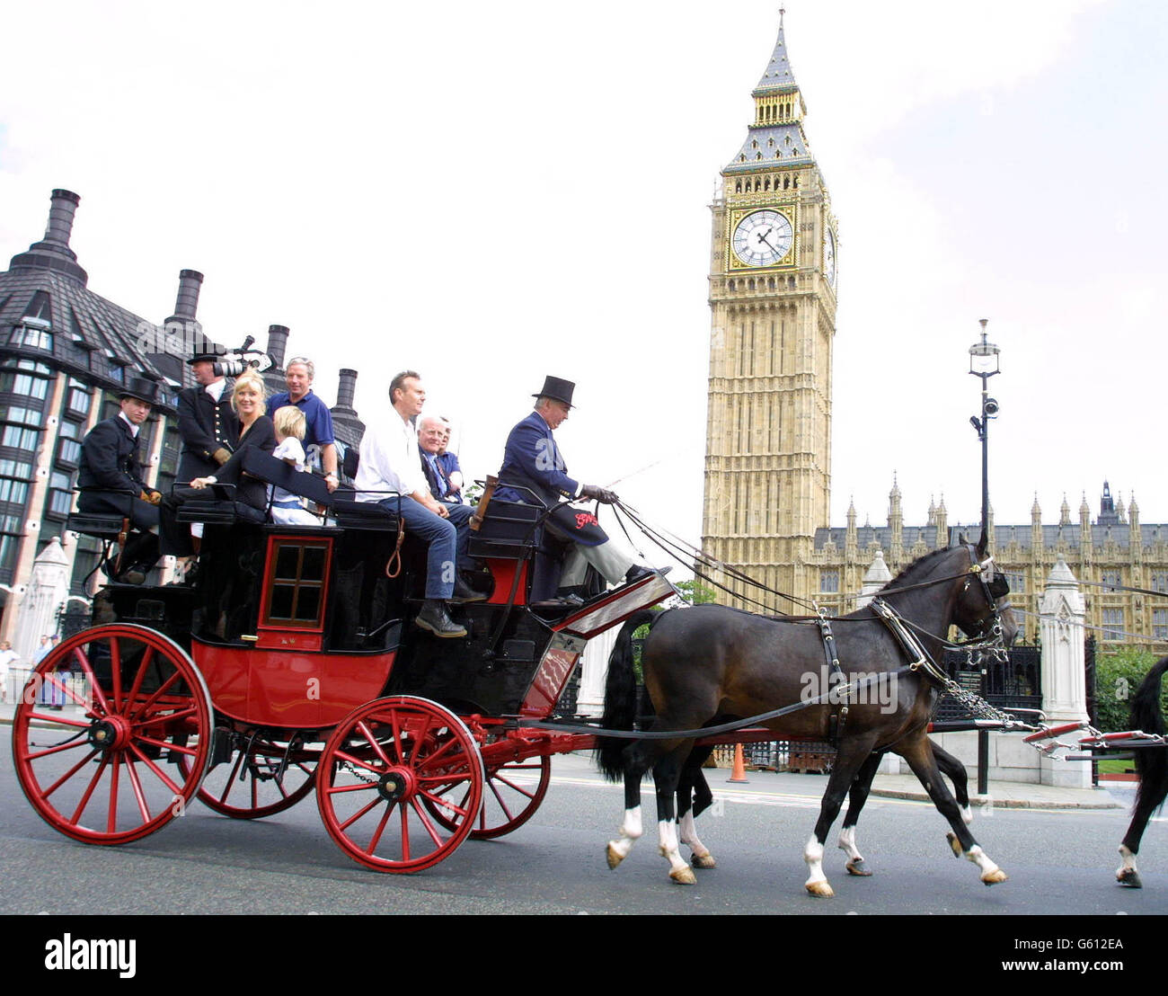 Actor Anthony Head (front white shirt) on a horse and carriage during the last leg of International League for the Protection of Horses (ILPH) Transportation Awareness Ride in Parliament Square in central London. The long distance ride, which started from Kelso in Scotland on July 27, hopes to raise awareness of the apalling conditions in which 133,000 are transported across Europe for slaughter every year. Stock Photo
