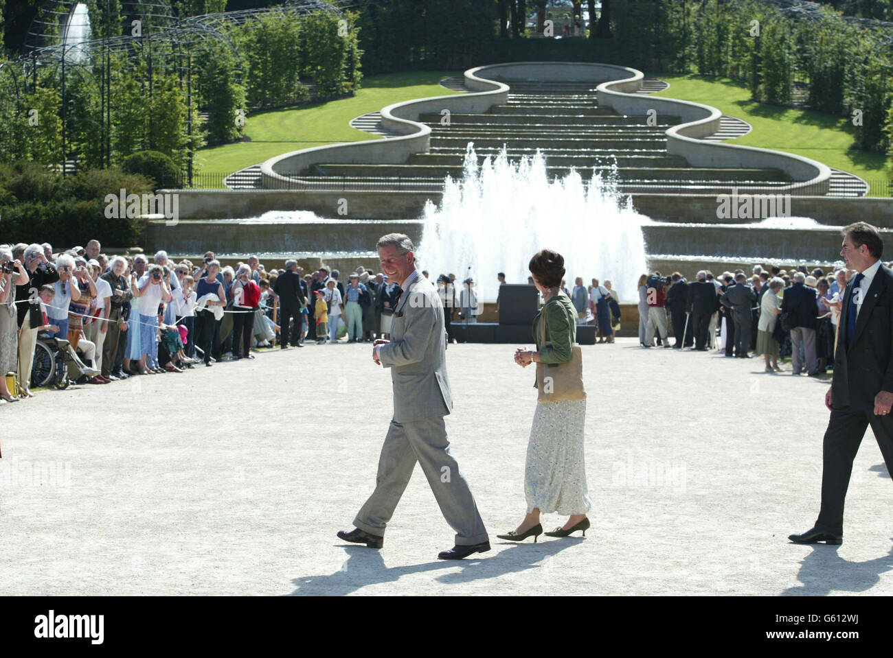 The Prince of Wales at Alnwick Gardens, where he opened the historic walled garden in the grounds of the estate of the Duchess of Northumberland (centre), who planned the seven-year 14 million project to restore the property to its former glory. * A central feature of the garden is a huge cascade of water, complete with fountains, which are believed to be the largest of its kind in this country. It took 150,000 man hours to complete and 7,260 gallons of water tumble down its 30 weirs every minute. Since the garden opened to the public in October last year almost 250,000 visitors have come Stock Photo