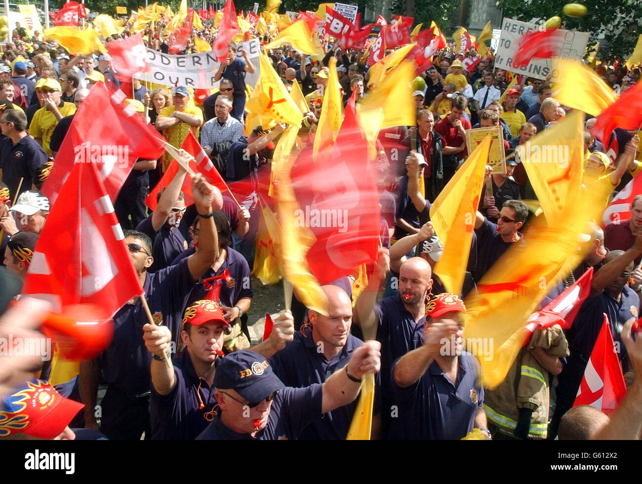 Firefighter Rally A sea of Fire Brigade Union flags (FBU) during a firefighters rally in ...