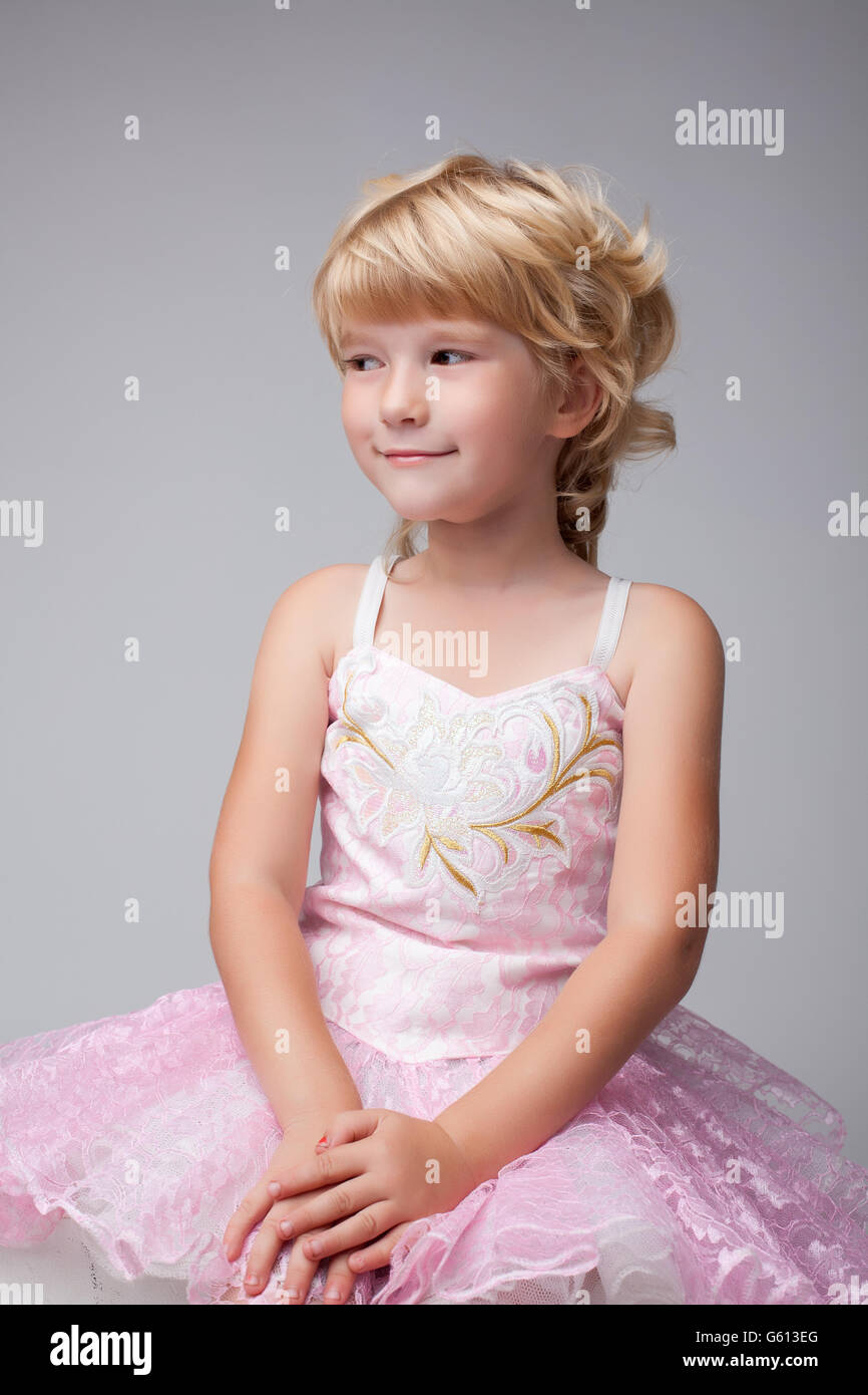 Portrait Of Cute Blonde Girl With Short Hair Stock Photo