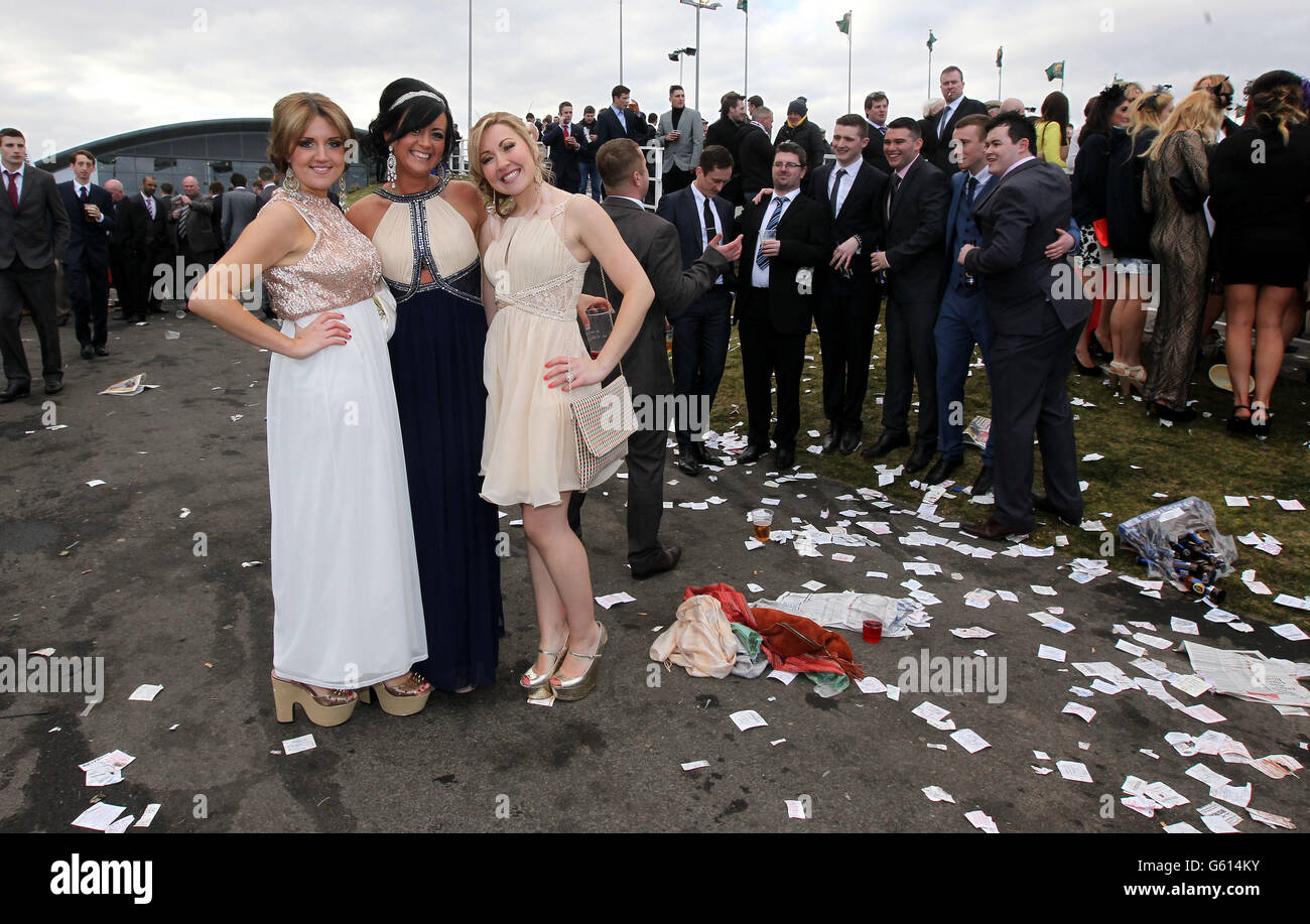Ladies pose for a picture during Ladies Day at the 2013 John Smith's Grand National Meeting at Aintree Racecourse, Sefton. Stock Photo