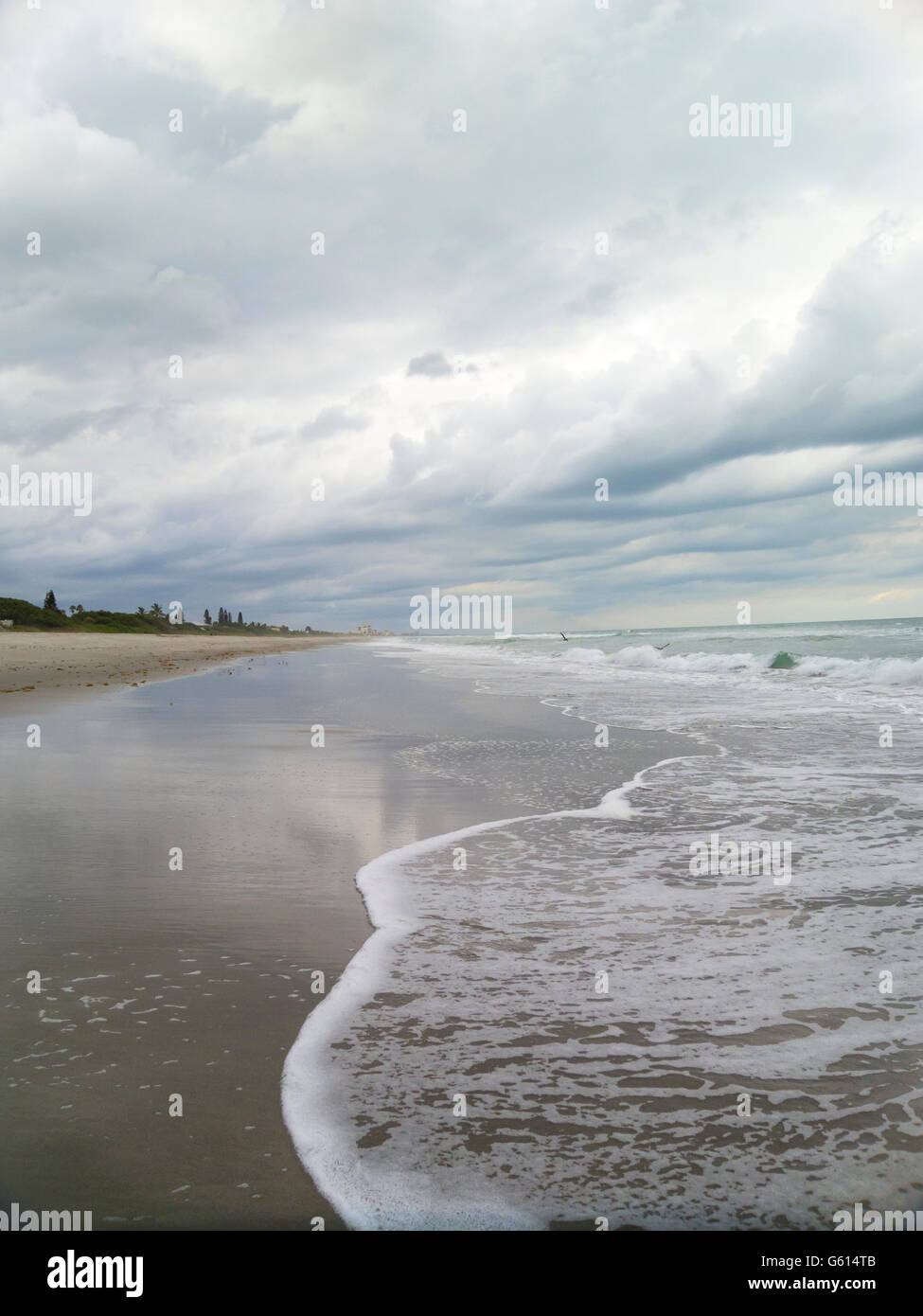 Shoreline with gathering storm clouds at Melbourne Beach, Florida, USA Stock Photo