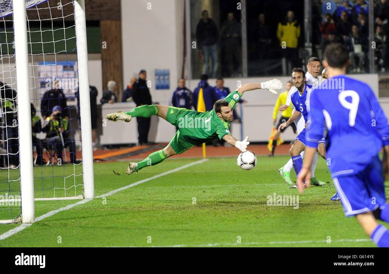 England's Jermaine Defo (blocked) scores past San Marino's Aldo Simoncini during the 2014 World Cup Qualifier at Serravalle Stadium, Serravalle, San Marino. Stock Photo