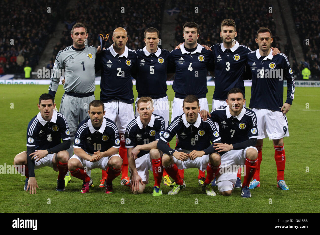 Scotland's (back row left to right) Allan McGregor, Alan Hutton, Gary Caldwell, Grant Hanley, Charlie Mulgrew and Steven Fletcher (front row left to right) Graham Dorrans, Shaun Maloney, Christopher Burke, james McArthur and Robert Snodgrass line up before the 2014 World Cup Qualifier at Hampden Park, Glasgow. Stock Photo