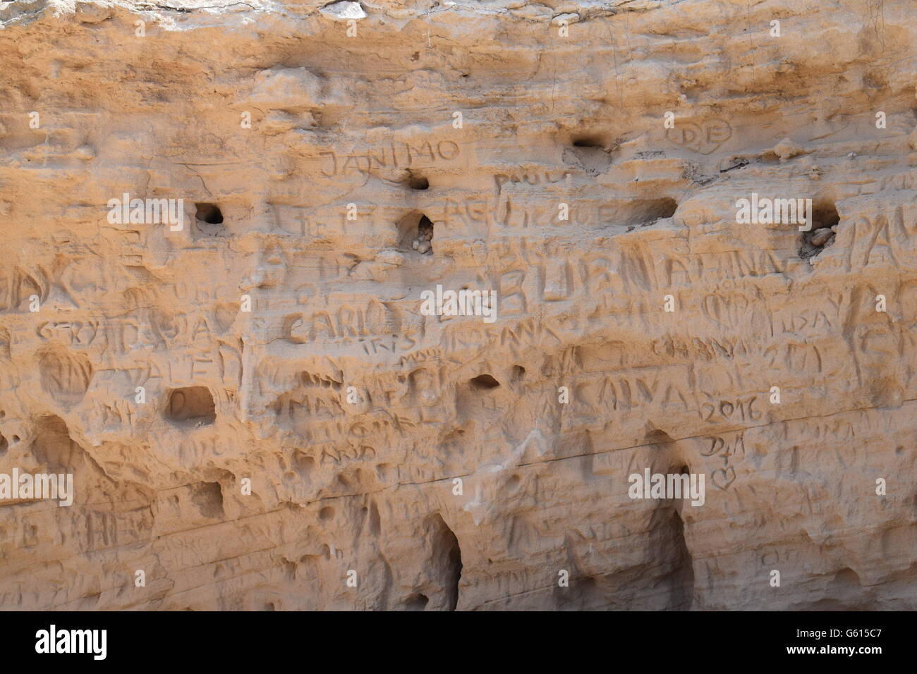 Names written into rock at Calo Saona, Formentera Stock Photo