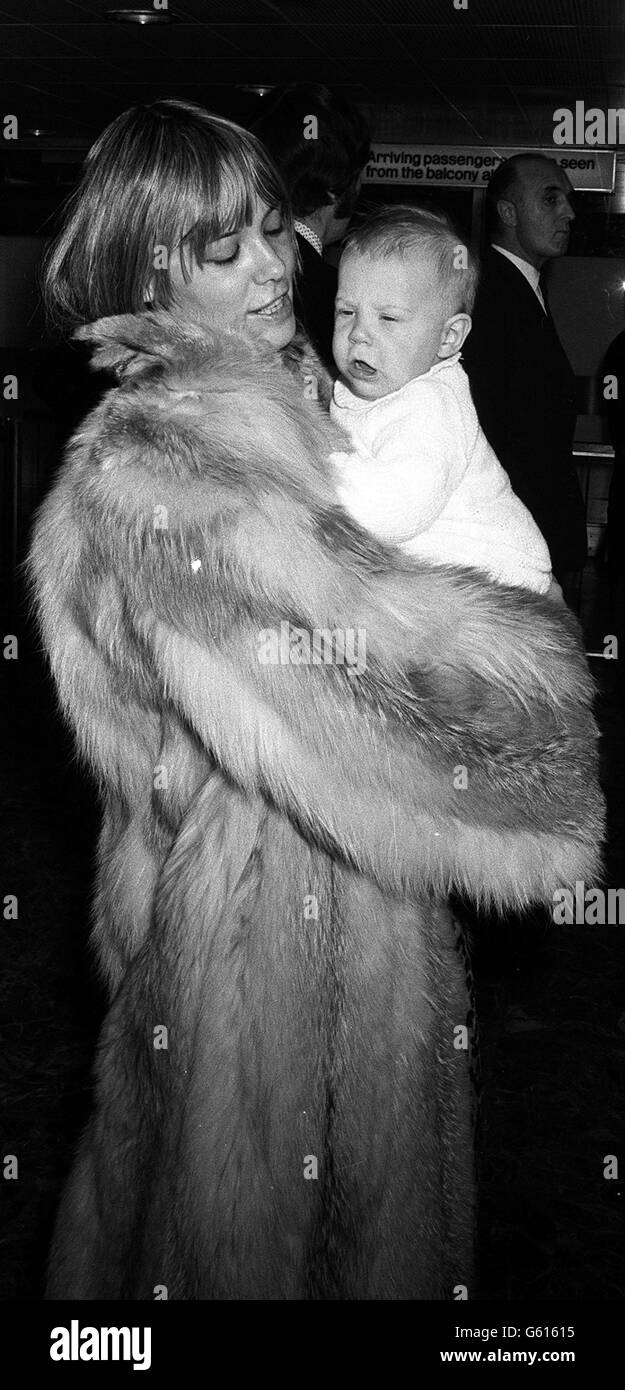 Model Anita Pallenberg, girlfriend of Rolling Stones' Keith Richards, with their son Marlon at Heathrow Airport, where they were waiting for the band to arrive back from an American tour. Stock Photo