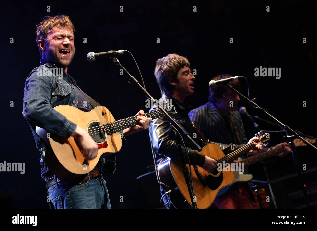 (left to right) Damon Albarn, Noel Gallagher and Graham Coxon performing on stage during their