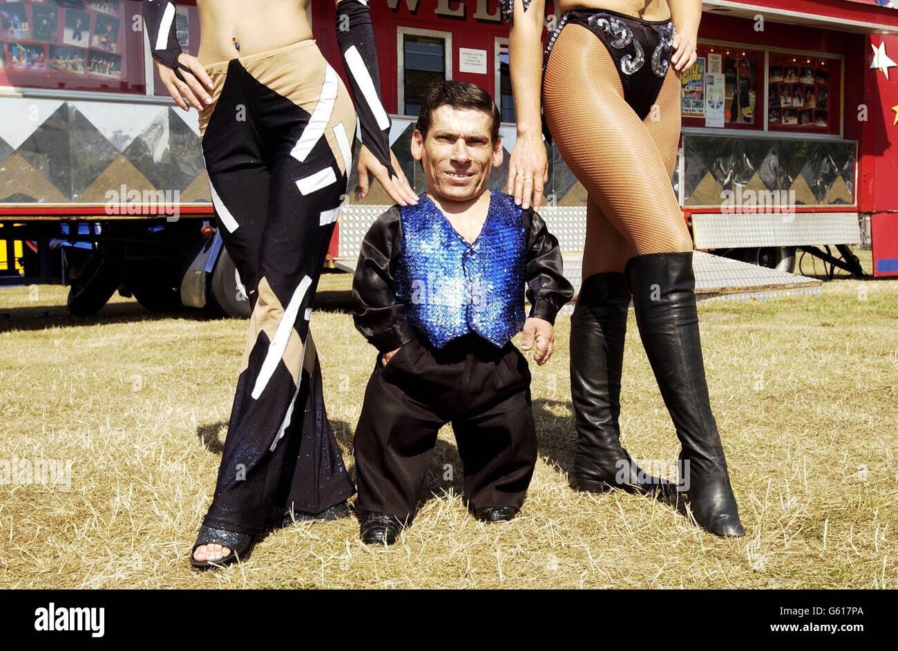 Pitchu, a circus entertainer with the Cottle and Austen Circus and thought to be the world's smallest man, stands with his friend Tito outside the big top on the day he has begun to search for a wife. *Hungarian Pitchu, 32, who is a knife thrower and acrobat at the Cottle and Austen Electric Circus presently in Portsmouth, has been going to bars and discos hoping to find love. At a photocall Pitchu admitted to being shy but said his perfect woman should be a least 5 feet tall. Stock Photo