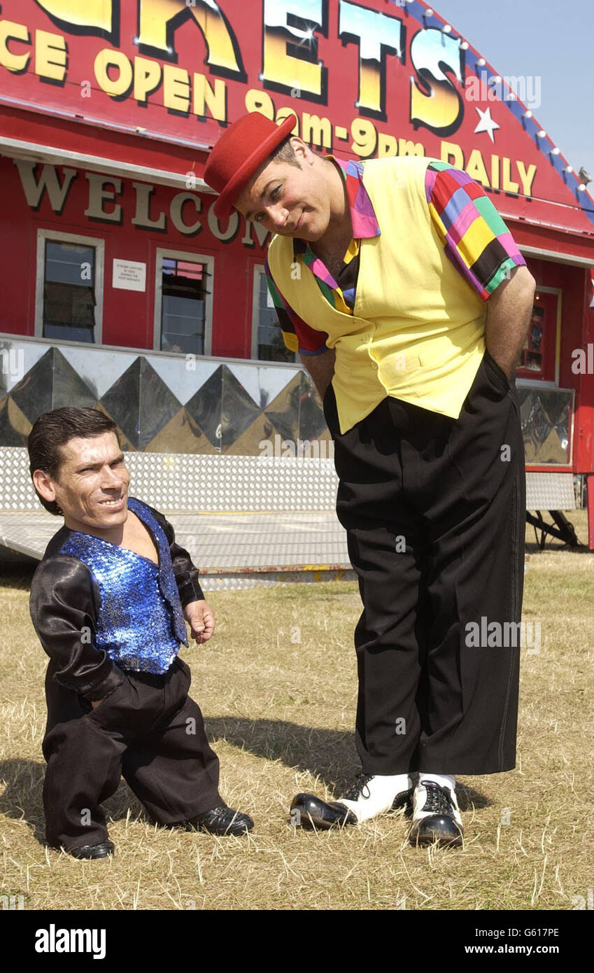 Pitchu (left), a circus entertainer with the Cottle and Austen Circus and thought to be the world's smallest man, stands with his friend Tito outside the big top on the day he has begun to search for a wife. *Hungarian Pitchu, 32, who is a knife thrower and acrobat at the Cottle and Austen Electric Circus presently in Portsmouth, has been going to bars and discos hoping to find love. At a photocall Pitchu admitted to being shy but said his perfect woman should be a least 5 feet tall. Stock Photo