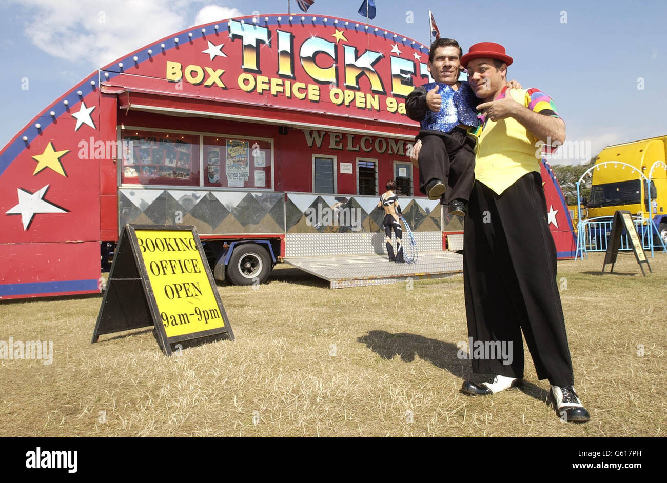 Pitchu (left), a circus entertainer with the Cottle and Austen Circus and thought to be the world's smallest man, stands with his friend Tito outside the big top on the day he has begun to search for a wife. *The 2ft 4ins Hungarian 32-year-old, who is a knife thrower and acrobat at the Cottle and Austen Electric Circus presently in Portsmouth, has been going to bars and discos hoping to find love. At a photocall Pitchu admitted to being shy but said his perfect woman should be a least 5 feet tall. Stock Photo