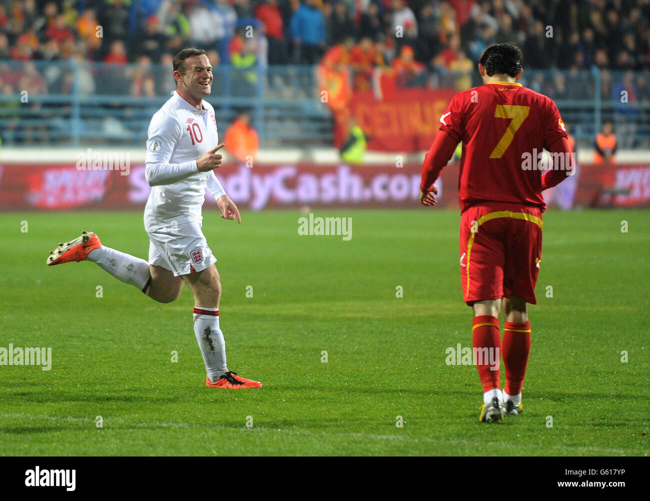 England's Wayne Rooney celebrates scoring during the FIFA World Cup Qualifying, Group H match at the City Stadium, Podgorica, Montenegro. Stock Photo