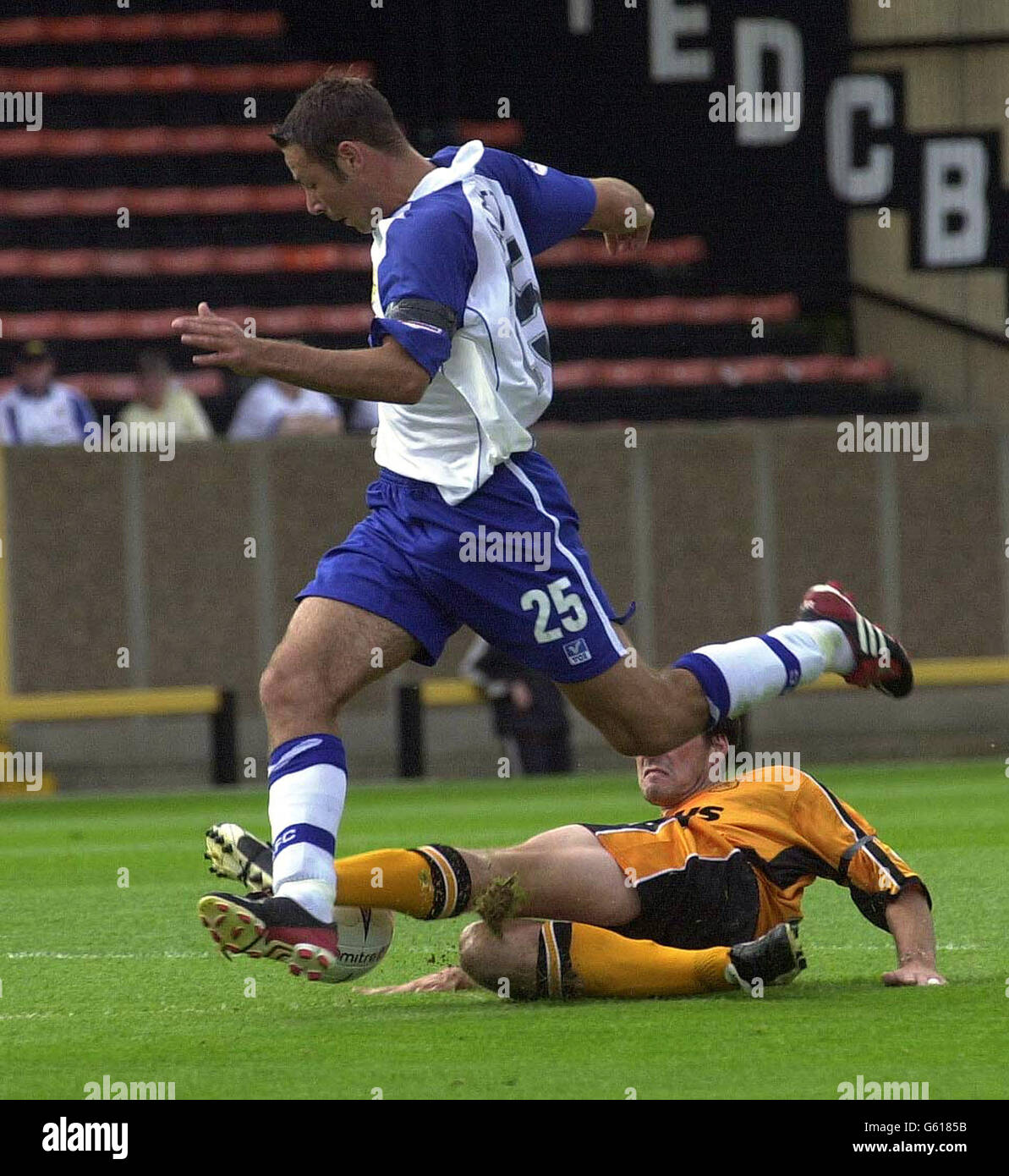 Hull City's Mark Greaves slides in for a tackle on Bury's Pawell Abbott during the Nationwide League Division Three game between Hull City and Bury at Boothferry Park. . Stock Photo
