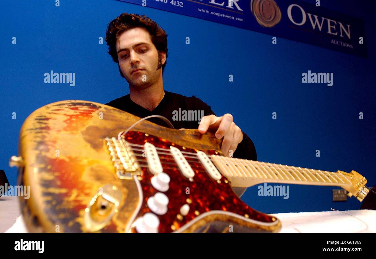 Dweezil Zappa, son of rockstar Frank Zappa, with the legendary Fender  Stratocaster burnt on stage by Jimi Hendrix at the 1968 Miami Pop festival,  during a photocall at the Copper Owen Gallery