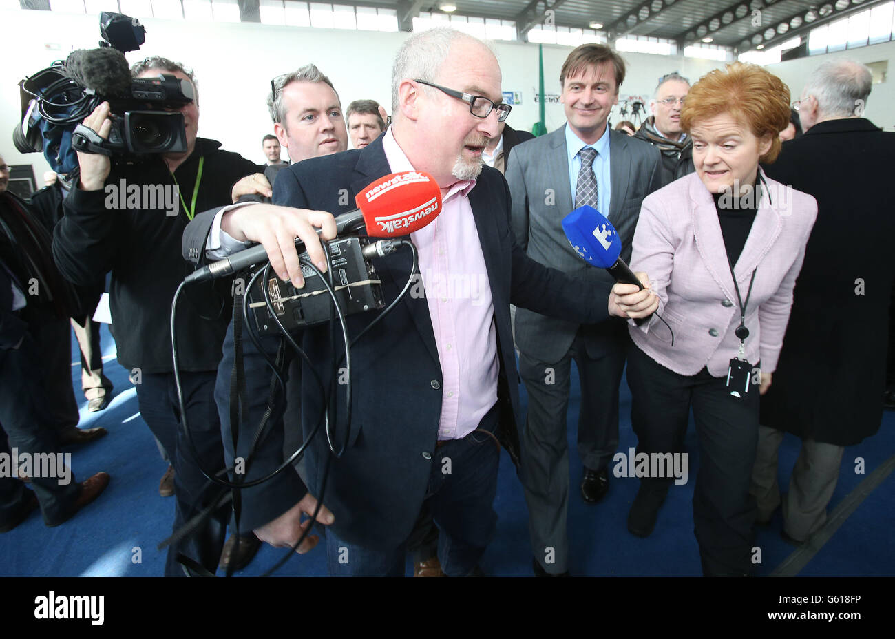 Labour candidate Eoin Holmes is pursued by the waiting media as counting continues in the Meath East by-election at Donaghmore GAA club. Stock Photo
