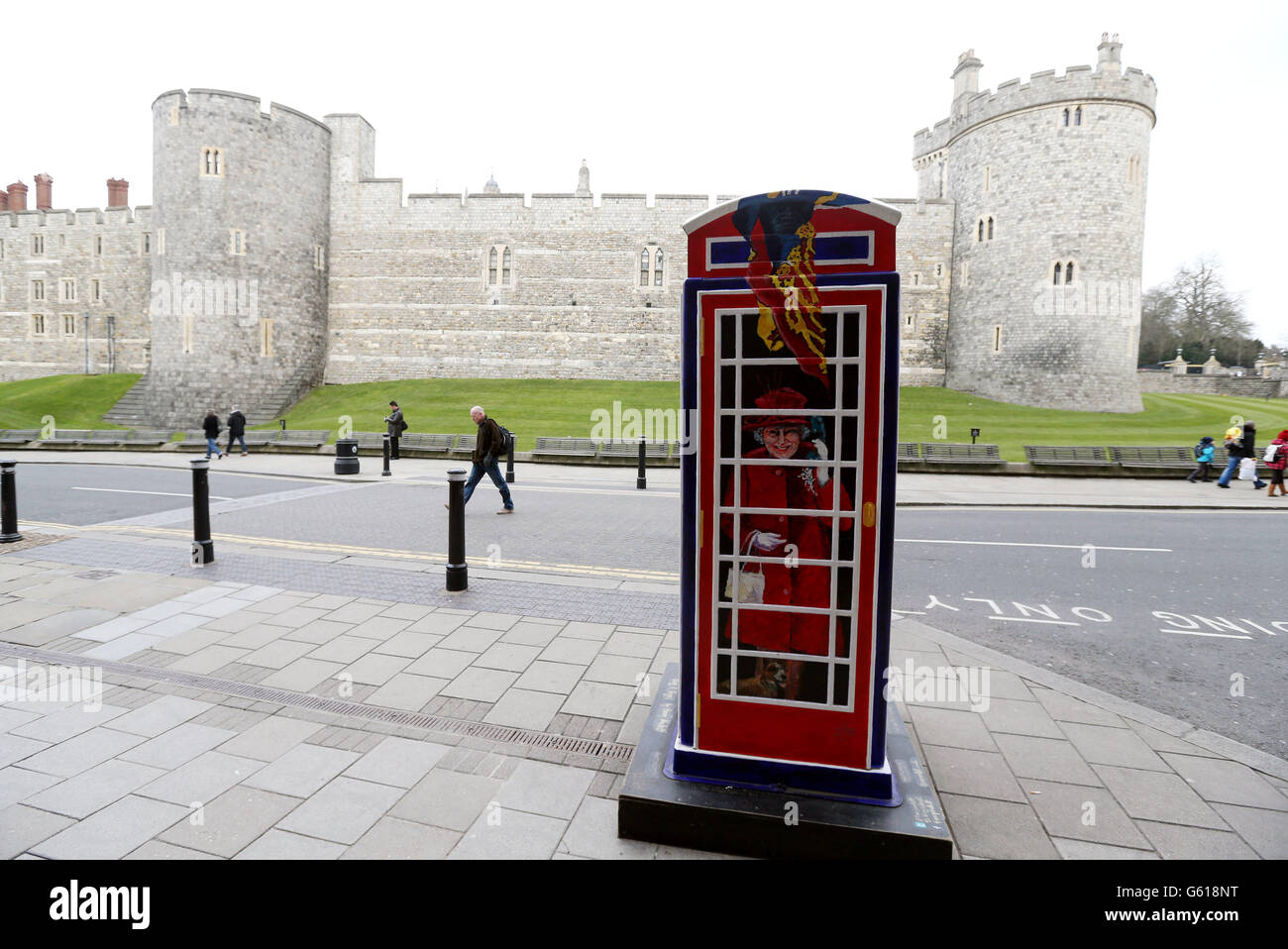 A phone box with images of Queen Elizabeth II, Prince Harry and the Duchess of Cambridge is on display in Windsor, Berkshire. The phonebox has been designed and painted by TV star Timmy Mallett and been named 'Ring-a-Royal-Phonebox'. Stock Photo