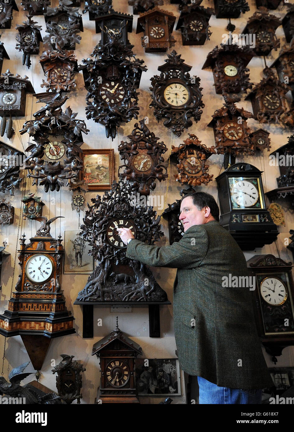 Roman Piekarski makes a start to changing the time on one of more than