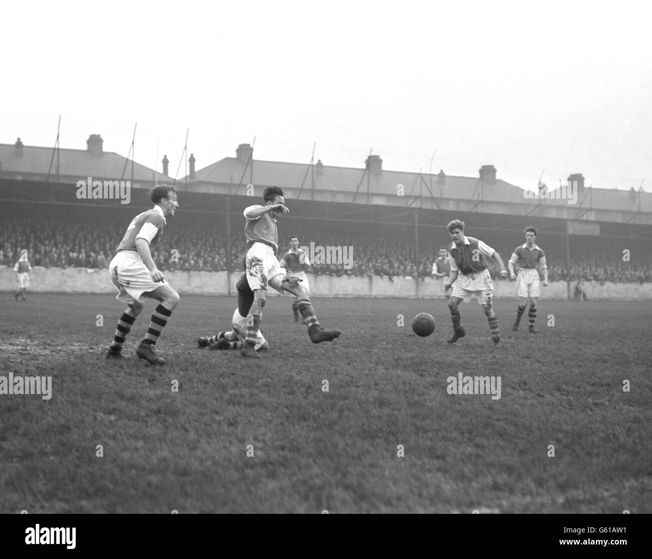 Douglas Clarke Walthamstow Avenue (l) Thomas Brown of Ipswich Town (far right) as Walthamstow Avenue try and clear the ball. Stock Photo