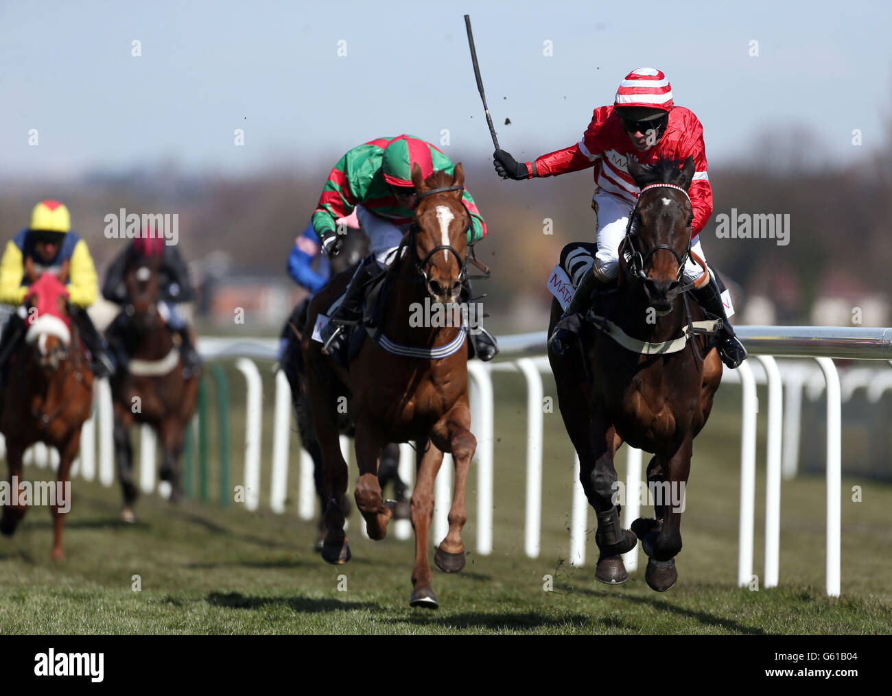 Wayne Hutchinson (right) celebrates victory on L'Unique in the Matalan Anniversary 4-Y-O Juvenile Hurdle during Grand Opening Day of the 2013 John Smith's Grand National Meeting at Aintree Racecourse, Sefton. Stock Photo