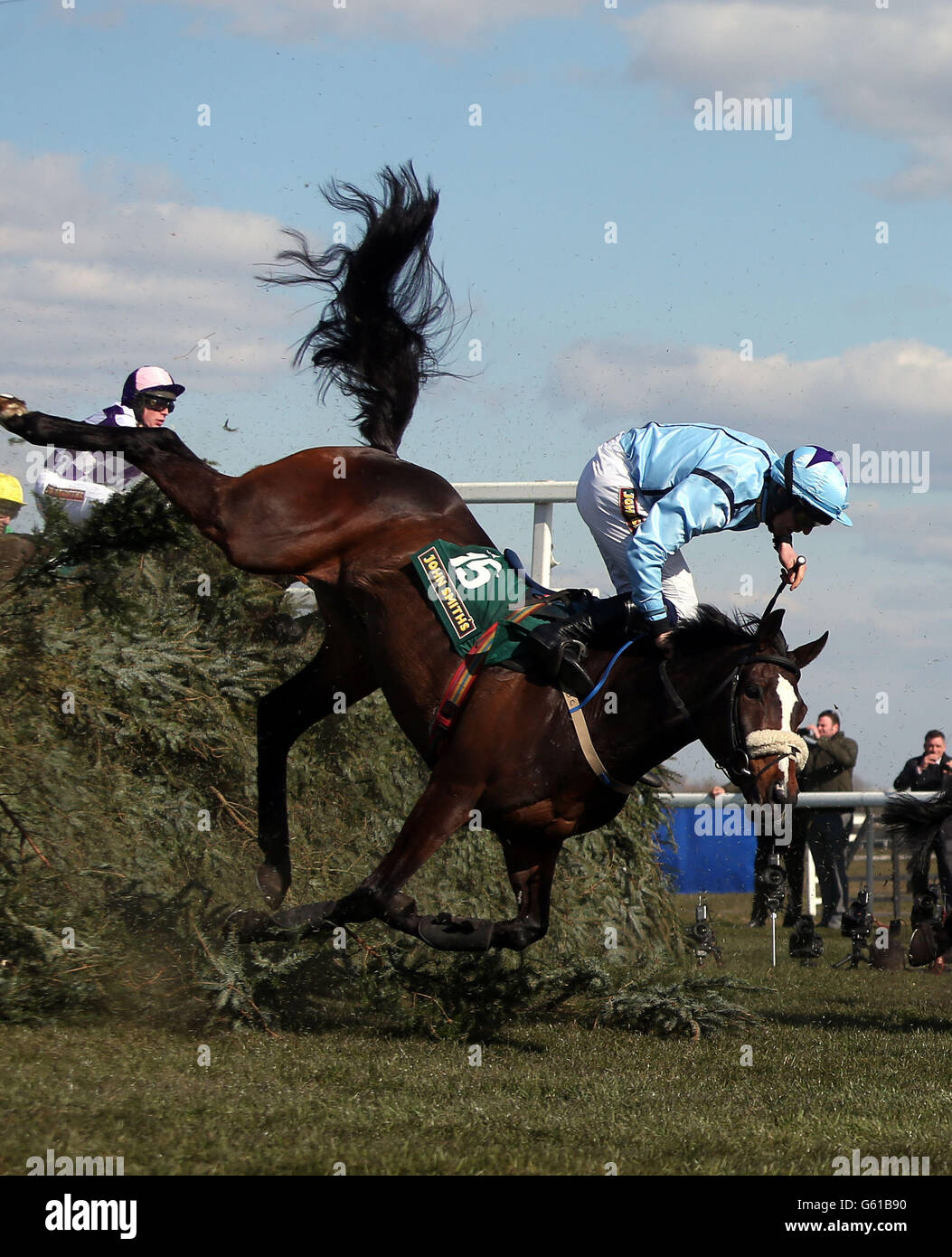 Mourne Paddy and Mr B.G. Crawford fall at The Chair in the John Smiths Fox Hunters' Chase during Grand Opening Day of the 2013 John Smith's Grand National Meeting at Aintree Racecourse, Sefton. Stock Photo