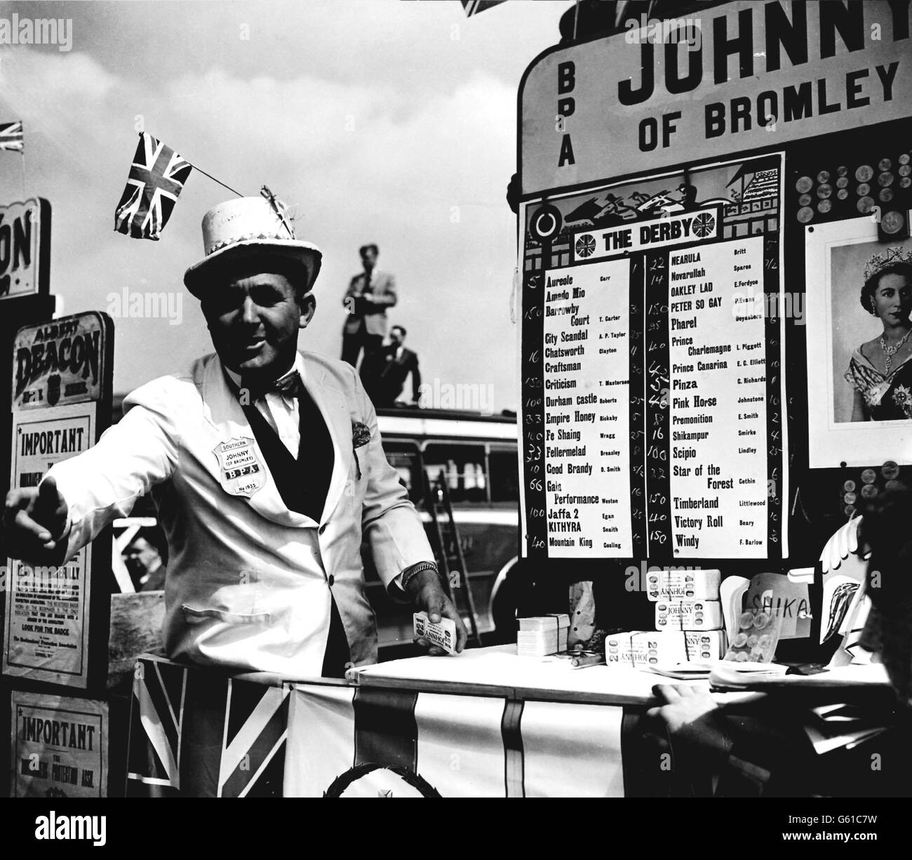 Bookie at Epsom.. Giving a grand patriotic display is one of the bookies on Epsom Down ready to