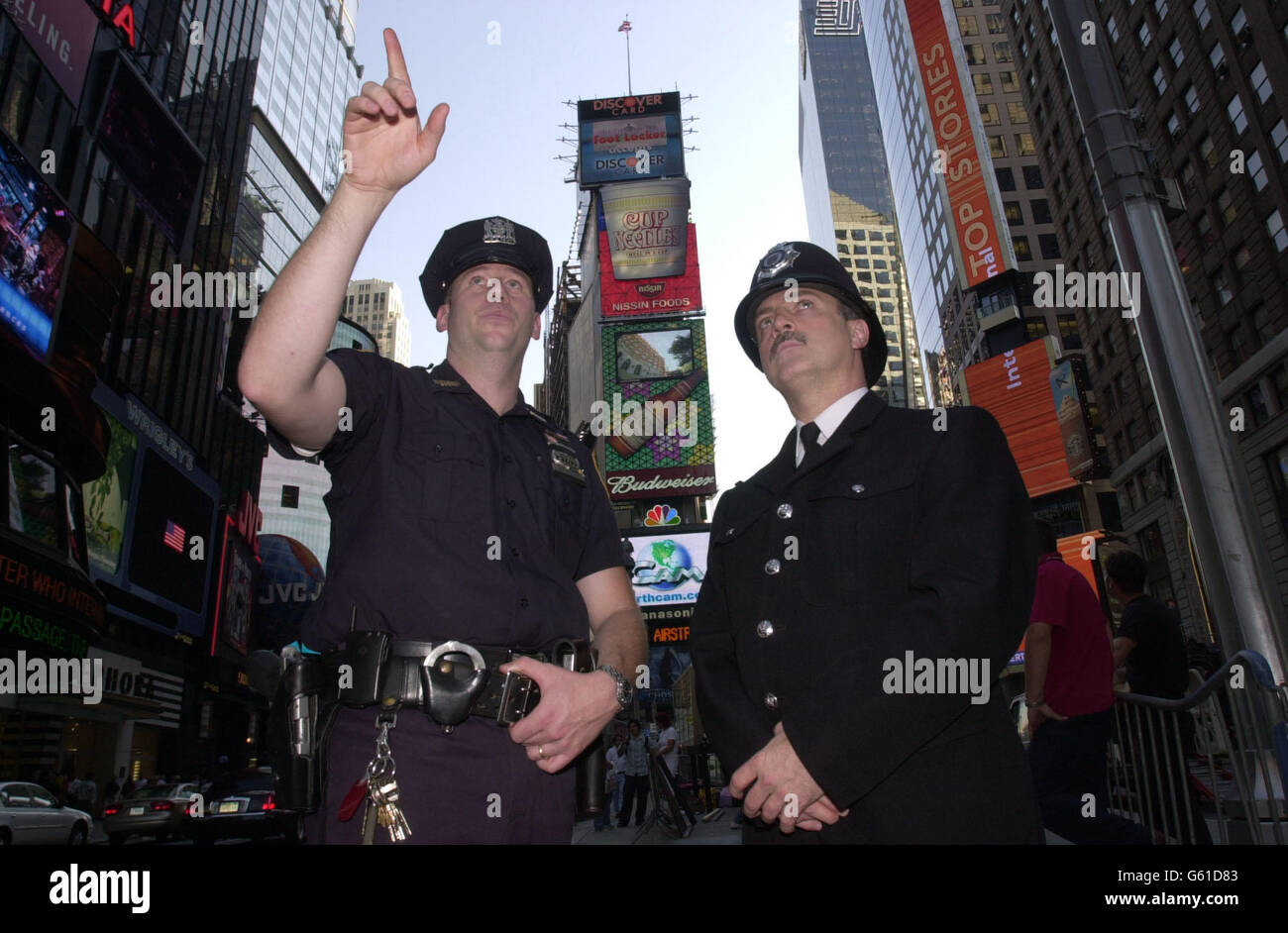 NYPD Officer Robert Wicklund (left) shows PC Norman Brennan around his beat of Times Square in New York before the anniversary of the terrorist attacks on the World Trade Center which will be attended by a contingent 340 British police officers. *... from forces all over the UK. Stock Photo