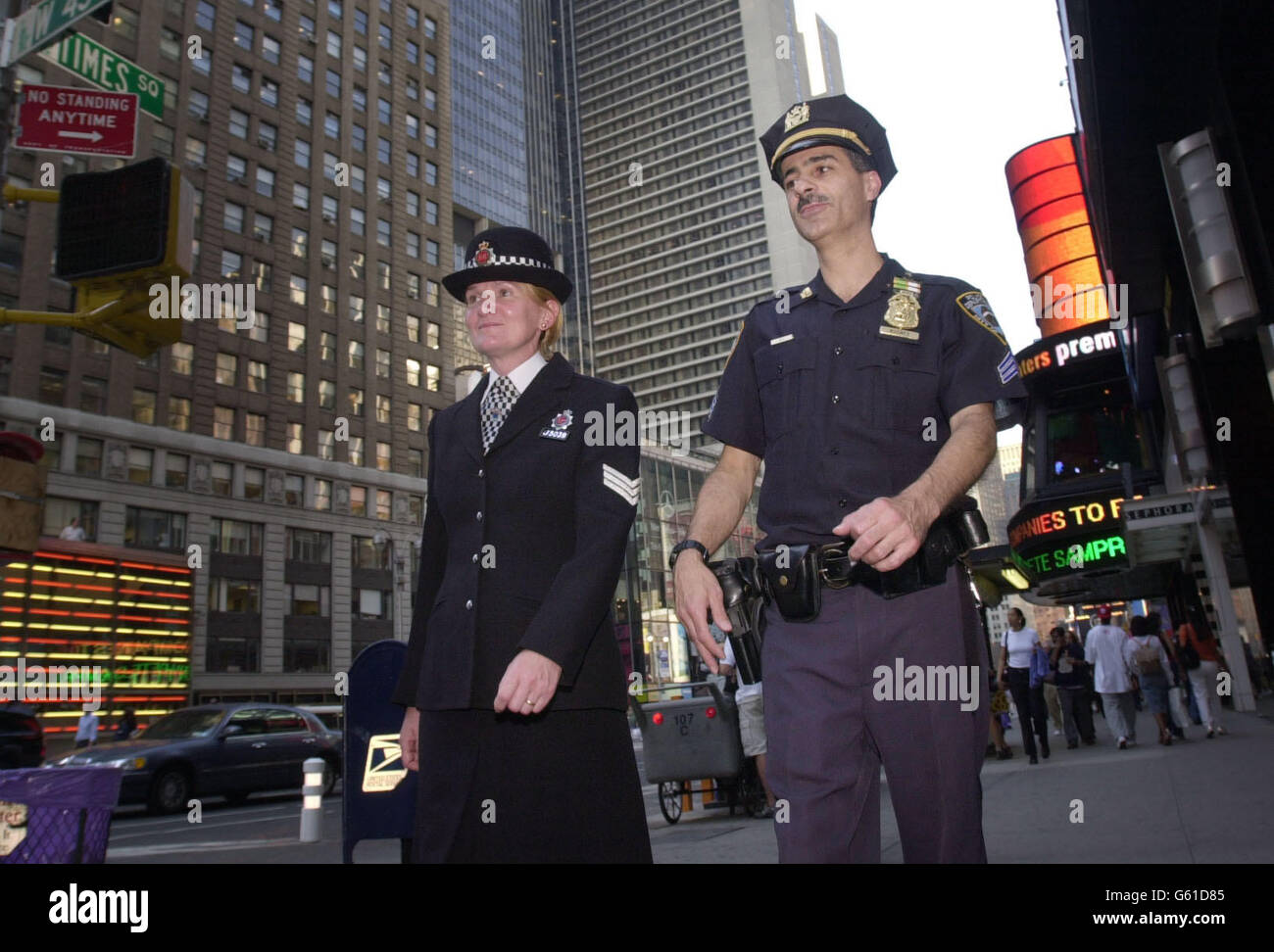 NYPD Officer Sgt Frank Nugnes (right) shows Sgt Rose Hudson of Greater Manchester Police around his beat of Times Square in New York before the anniversary of the terrorist attacks on the World Trade Center which will be attended by 340 British police officers. *... from forces all over the UK. Stock Photo