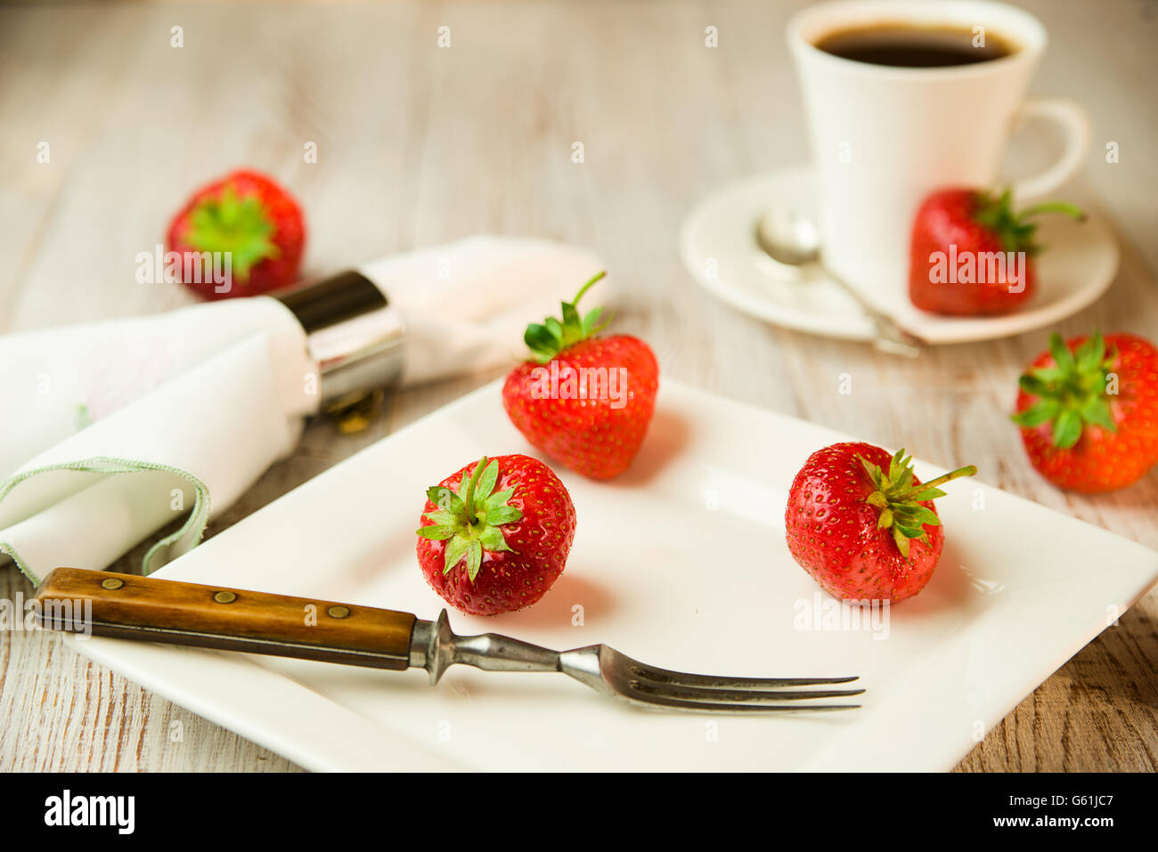 Ripe red strawberries on a white plate Stock Photo - Alamy