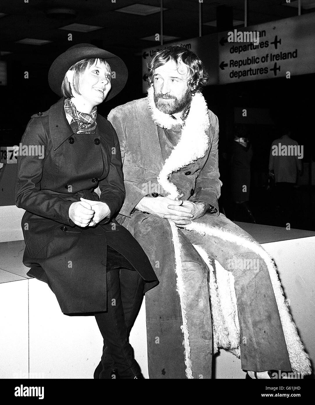 Pop singer Lulu and actor Richard Harris are pictured at Heathrow Airport, when they left for Luxembourg in a party of showbusiness personalities. Lulu had a slight hitch when she discovered she had forgotten her passport, and had to get her husband, Maurice Gibb, out of bed to bring it to the airport. CELEBRITY Stock Photo