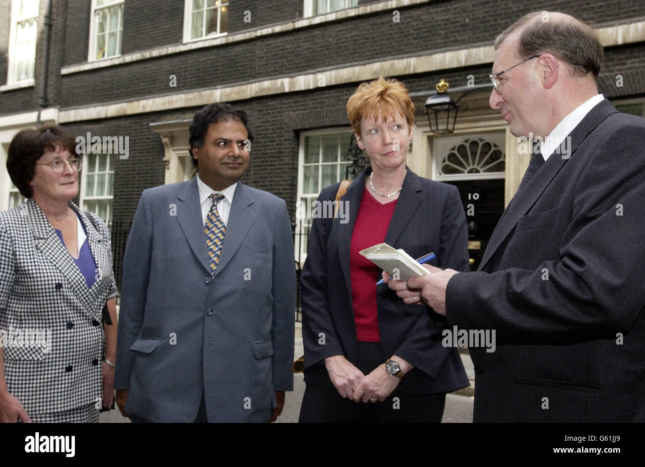 Teeside MP's Dari Taylor (left), Ashok Kumar (centre) and Vera Baird (right) are interviewed by the Evening Gazette's Parliamementary correspondant Bill Doult after handing in a petition containing the signatures of 3700 people from the Teeside area. * ... at No.10 Downing Street, London. The MP's presesented the petition, which called for tighter controls of air guns, (including the banning of ownership by youngsters), with a personal letter from the parents of Matthew Sheffield, a 14-year-old from Eaglescliffe, who was tragically killed when accidently shot with an air gun by a close friend. Stock Photo