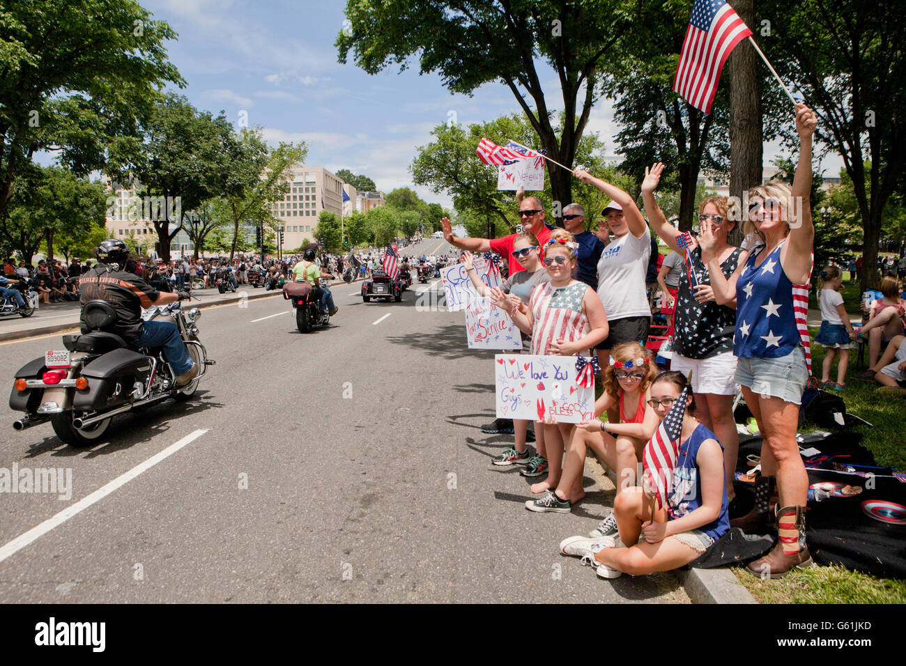 Washington, DC USA, May 29th, 2016: Supporters waving flags during Memorial Day Weekend Rolling Thunder Ride Stock Photo