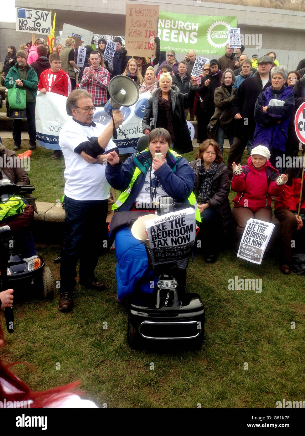 People march the streets of Edinburgh in a protest over cuts to housing
