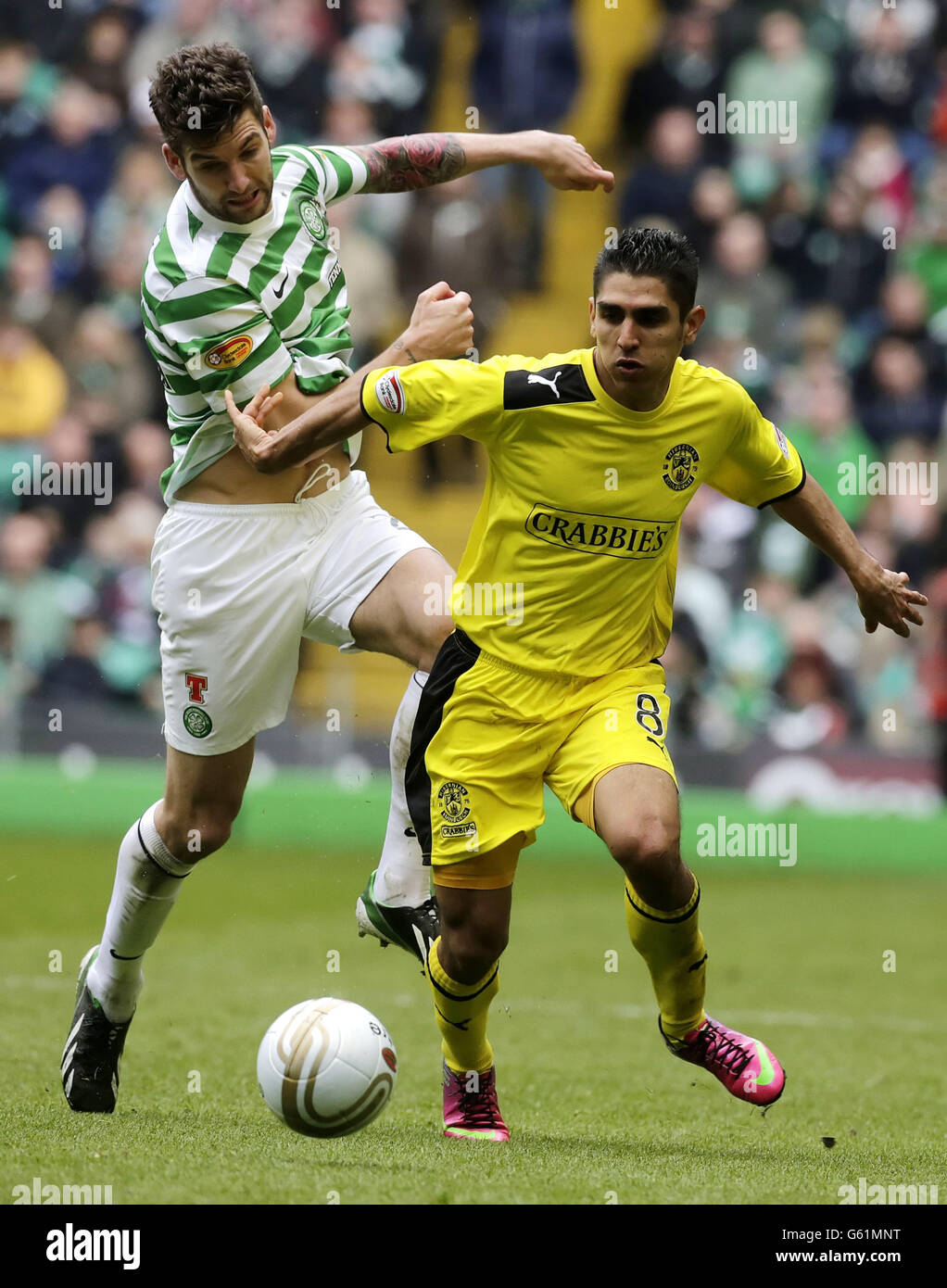 Celtic's Charlie Mulgrew and Hibernian's Jorge Claros fight for the ball during the Clydesdale Bank Scottish Premier League match at Celtic Park, Glasgow. Stock Photo