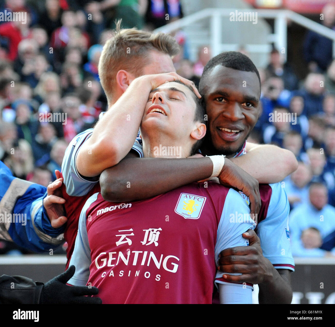 Aston Villa's Matthew Lowton is congratulated by Christian Benteke on scoring their second goal during the Barclays Premier League match at the Britannia Stadium, Stoke on Trent. Stock Photo