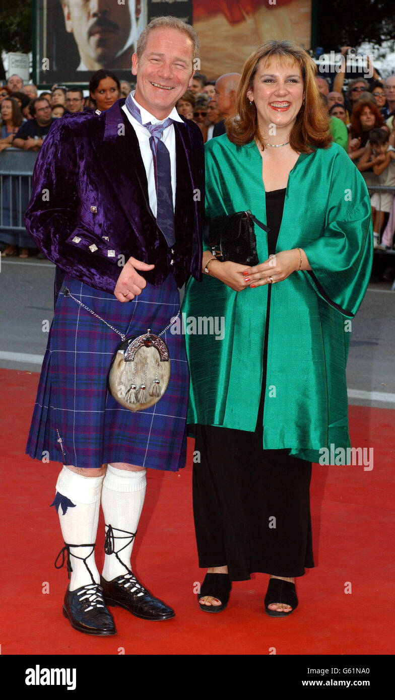 British Director Peter Mullan arrives with his wife Ann Swan at the closing ceremony of the 59th Venice film festival, Venice, Lido, Italy. Mullan won the Golden Lion award for his film 'The Magdalene Sisters'. Stock Photo