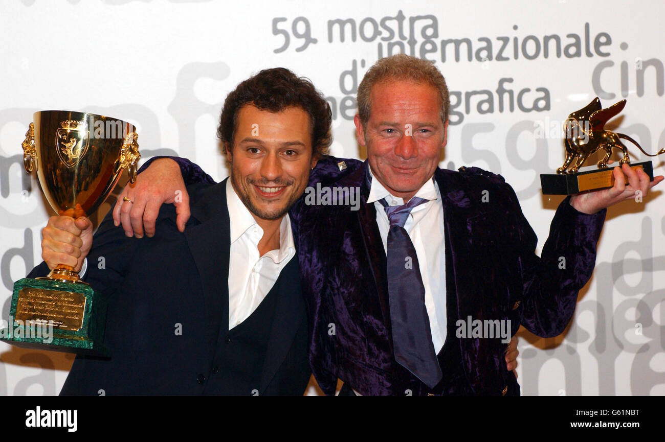 Scottish director Peter Mullan (right) holds the Golden Lion award alongside Italian Actor Stefano Accorsi with his Best Actor award for the movie 'Un viaggio chiamatto amore', during the closing ceremony of the 59th Venice film festival, Venice, Lido, Italy. *...Mullan won the Golden Lion award for his film 'The Magdalene Sisters'. Stock Photo